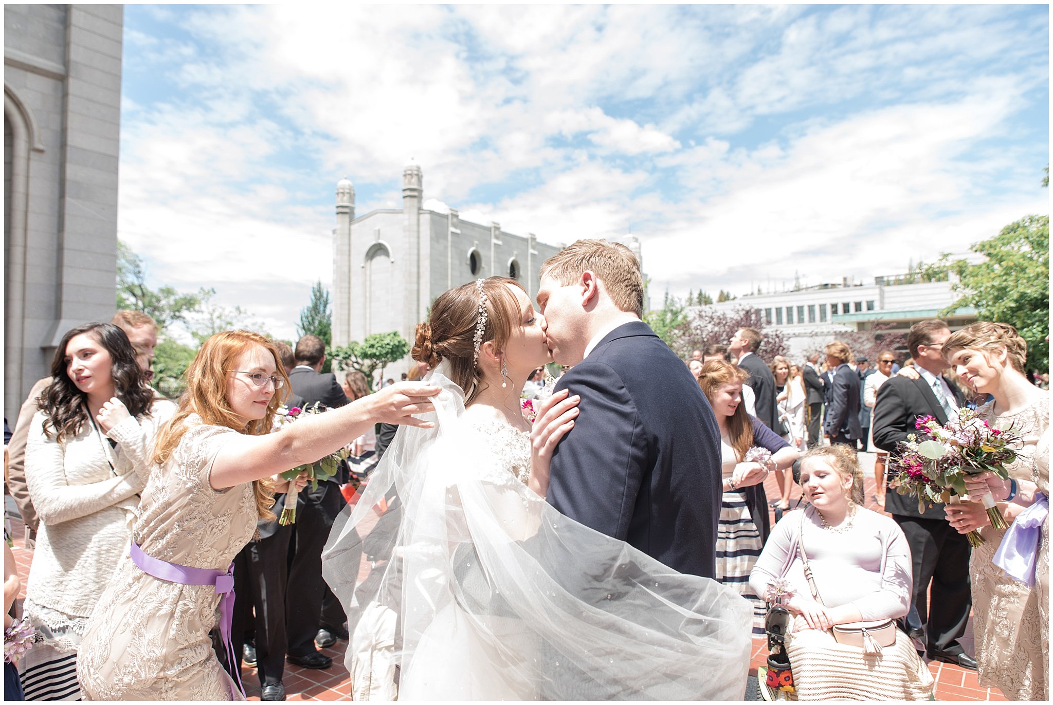 Bride and groom exit from Salt Lake Temple kiss | Candid wedding photography | Jessie and Dallin Photography