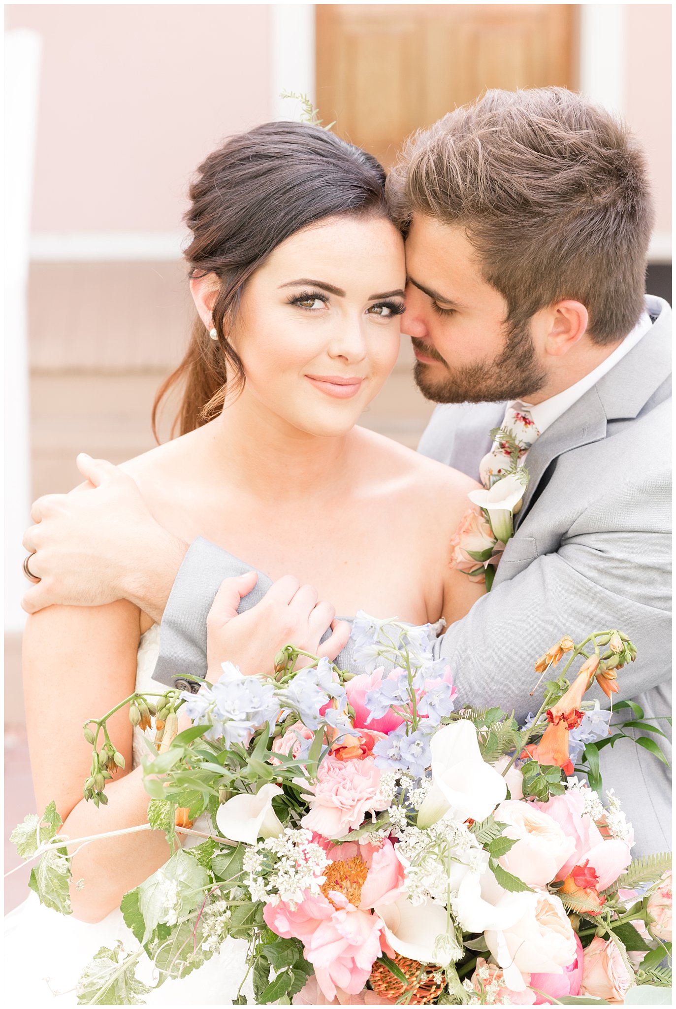 Couple nuzzling on steps | This is the Place Heritage Park | Green and Pink Garden Wedding | Jessie and Dallin Photography