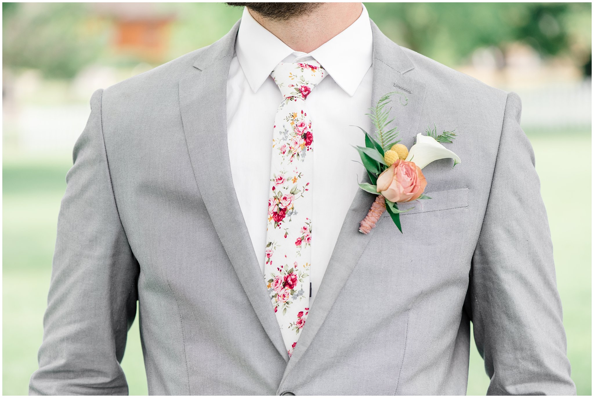Groom detail of floral tie, boutonniere and grey suit | This is the Place Heritage Park | Green and Pink Garden Wedding | Jessie and Dallin Photography
