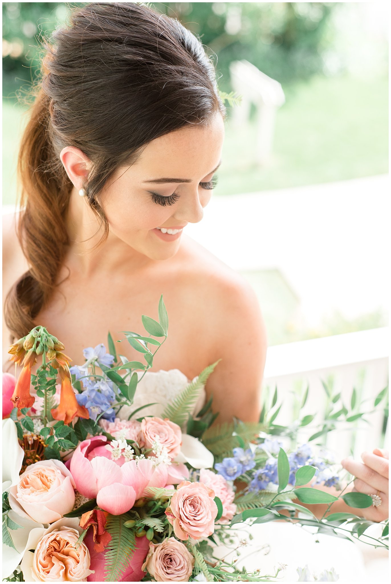Bride smiling down at florals | This is the Place Heritage Park | Green and Pink Garden Wedding | Jessie and Dallin Photography