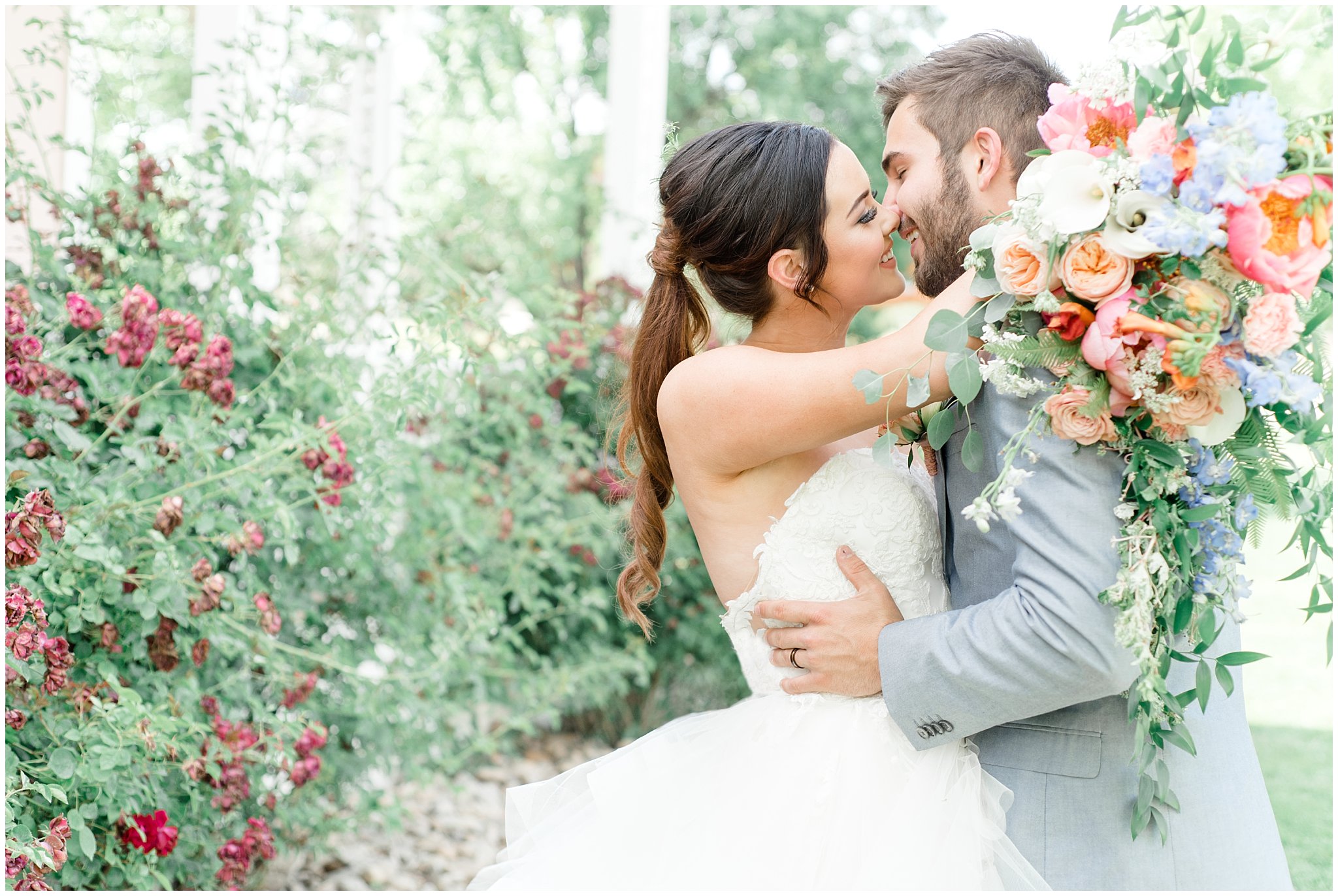 Bride and groom kissing in garden | This is the Place Heritage Park | Green and Pink Garden Wedding | Jessie and Dallin Photography