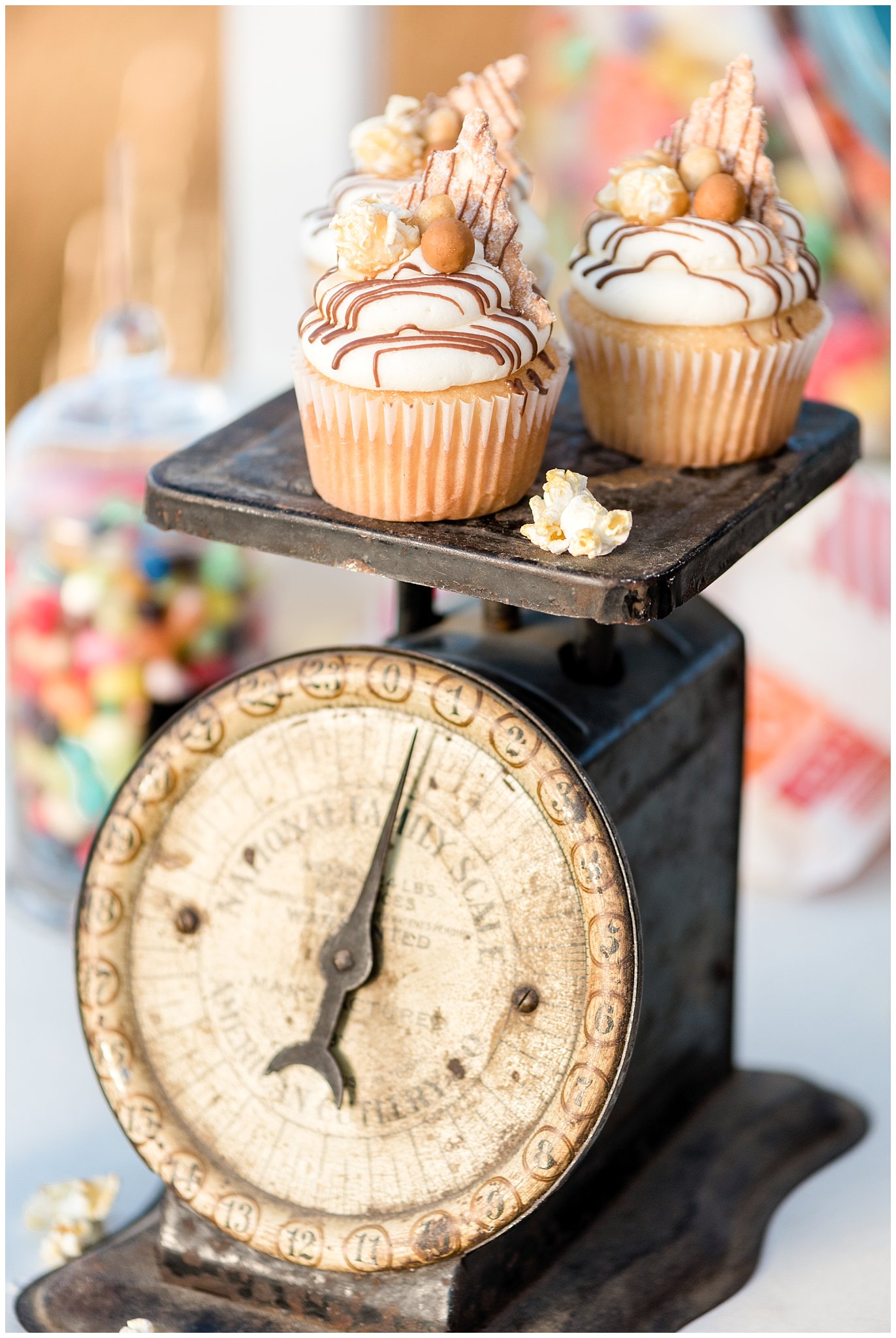 caramel wedding cupcakes on a vintage scale at the boardwalk in Utah | Jessie and Dallin Photography | Utah Wedding Photographers