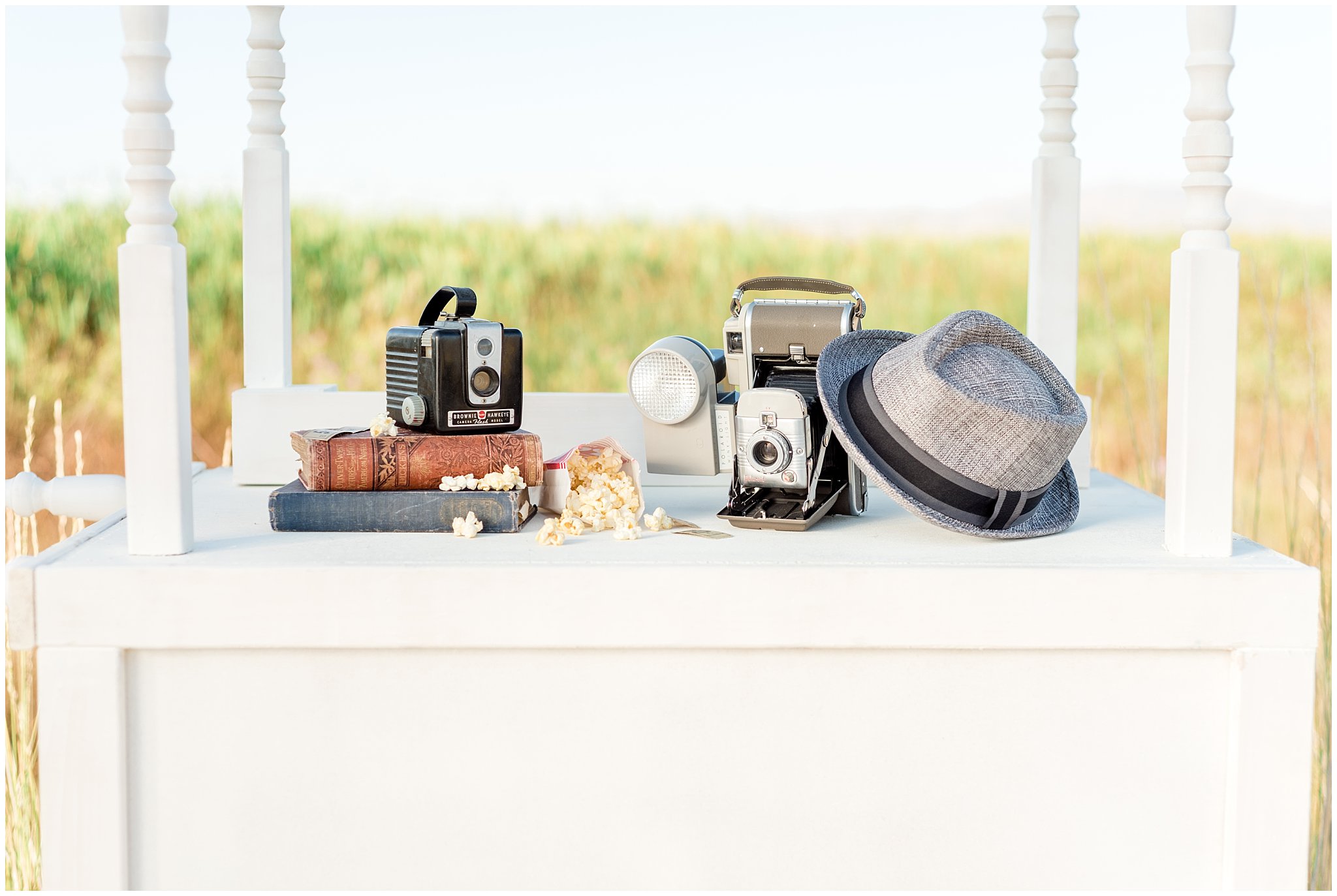 Vintage fedora hat, cameras and books for wedding decor in Utah | Jessie and Dallin Photography | Utah Wedding Photographers