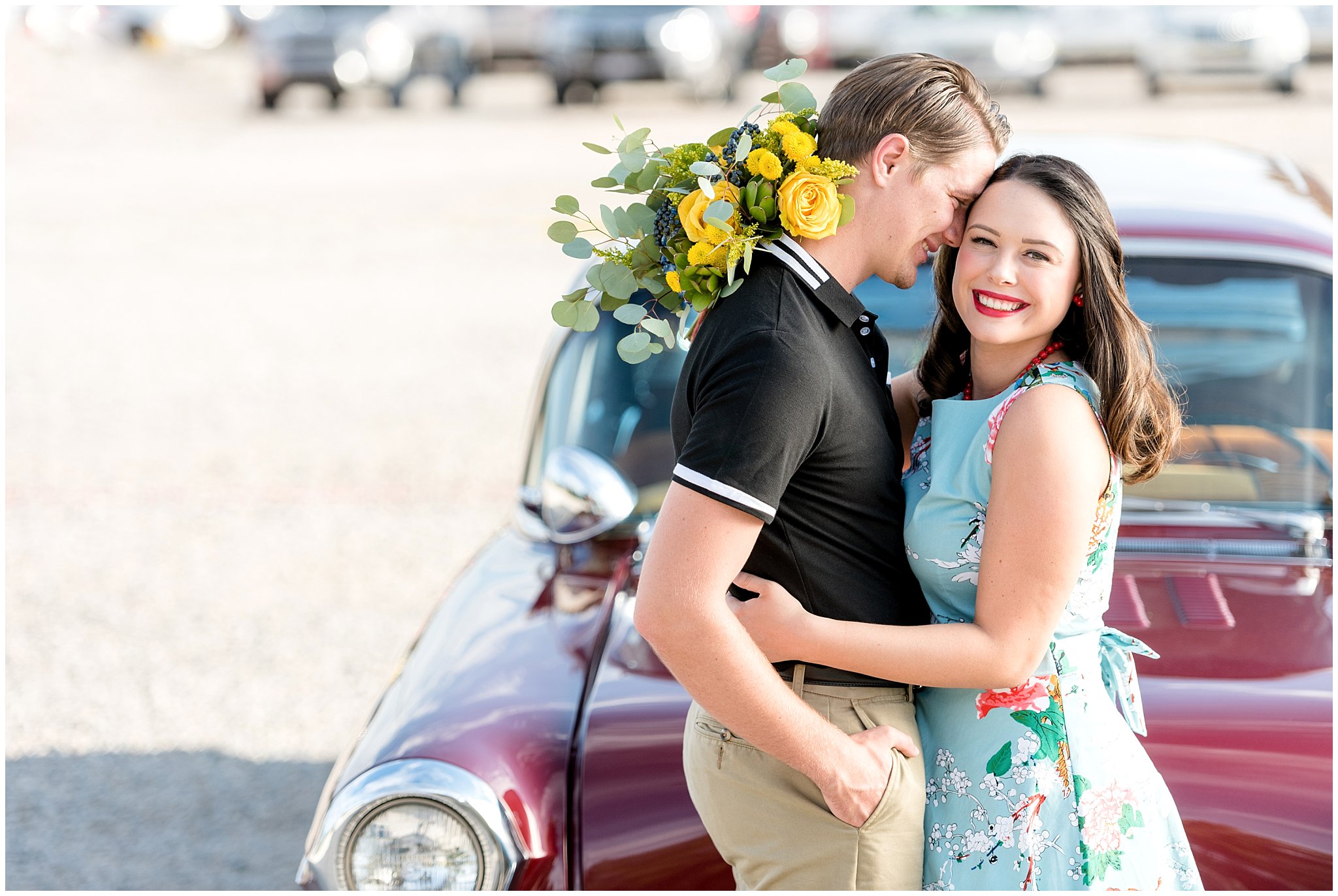 Couple in front of classic car during their engagement session at the state fair in Utah | Jessie and Dallin Photography | Utah Wedding Photographers