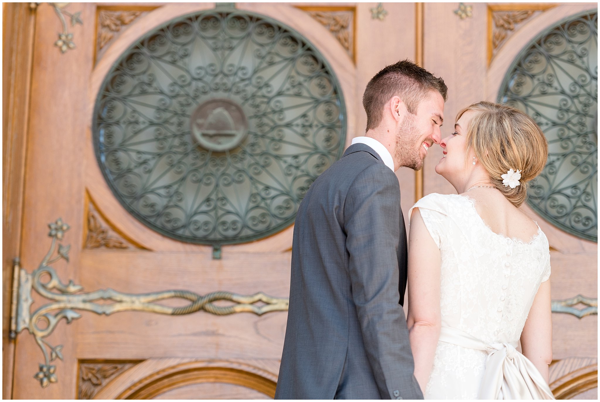 Salt Lake Temple spring wedding | Coral and grey wedding | Bride and groom pictures on the stairs