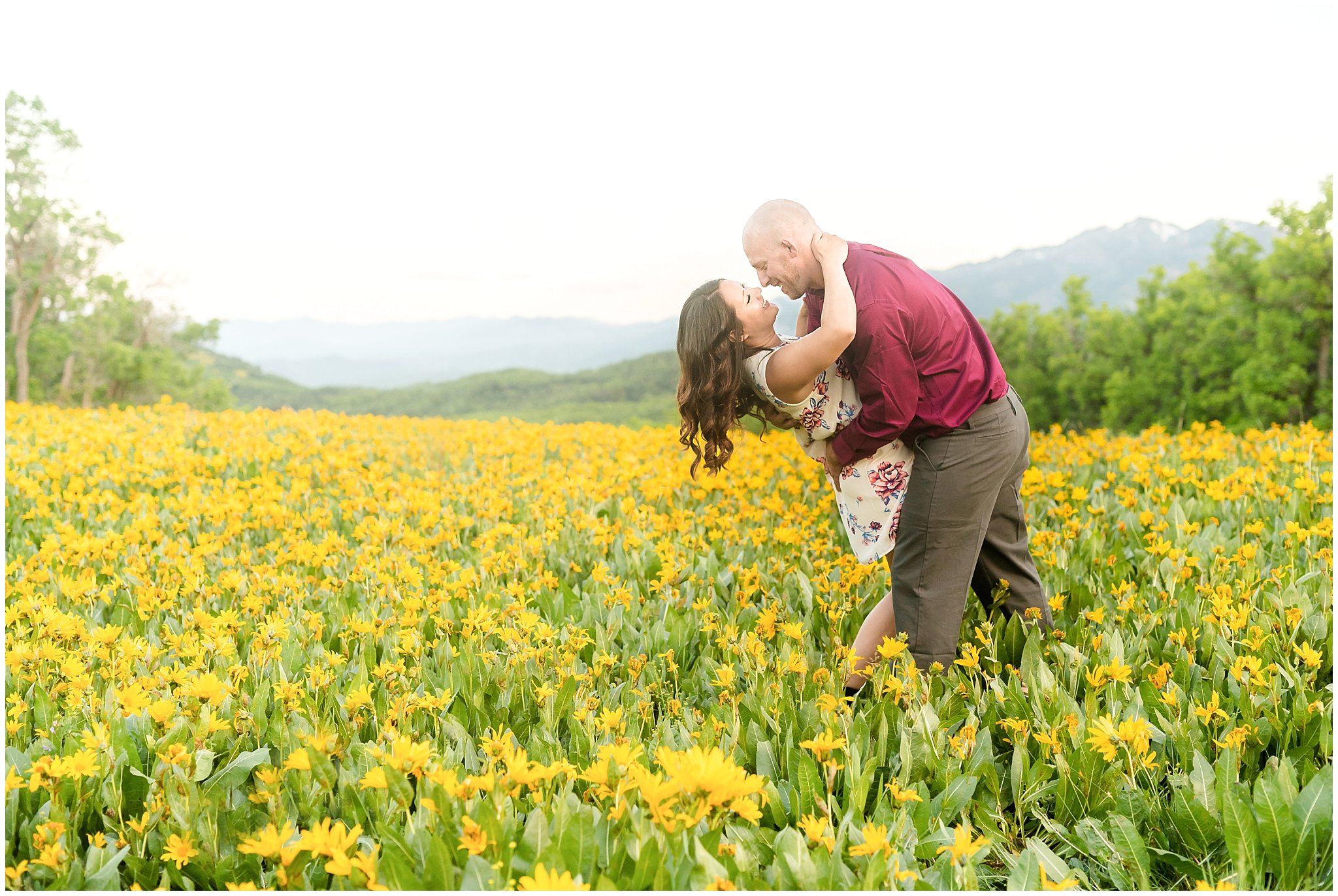 Couple's romantic engagement session in the mountains with wildflowers | Snowbasin Utah Engagements