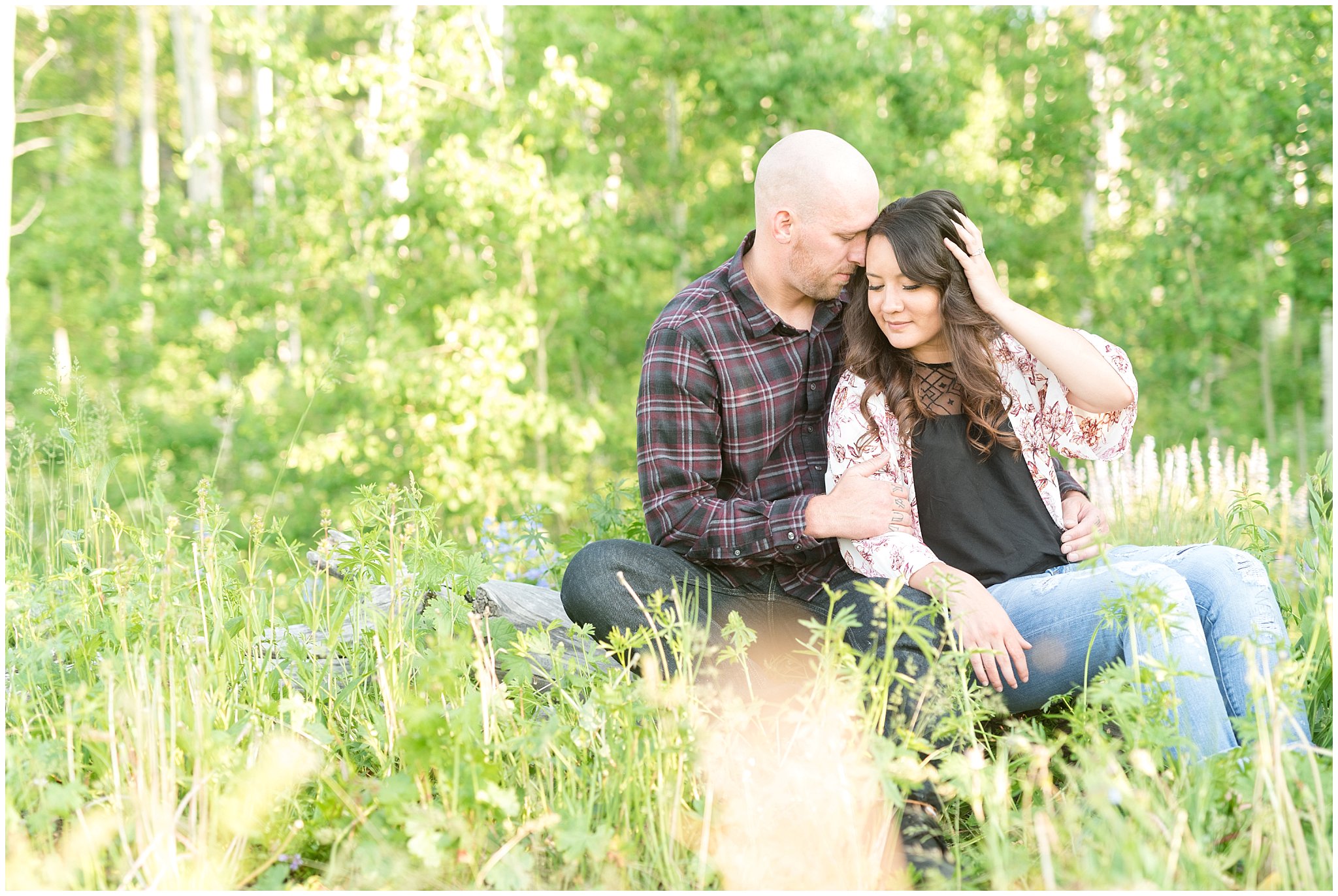 Couple in the Aspen Trees and wildflowers during engagement session | Snowbasin Utah Engagements