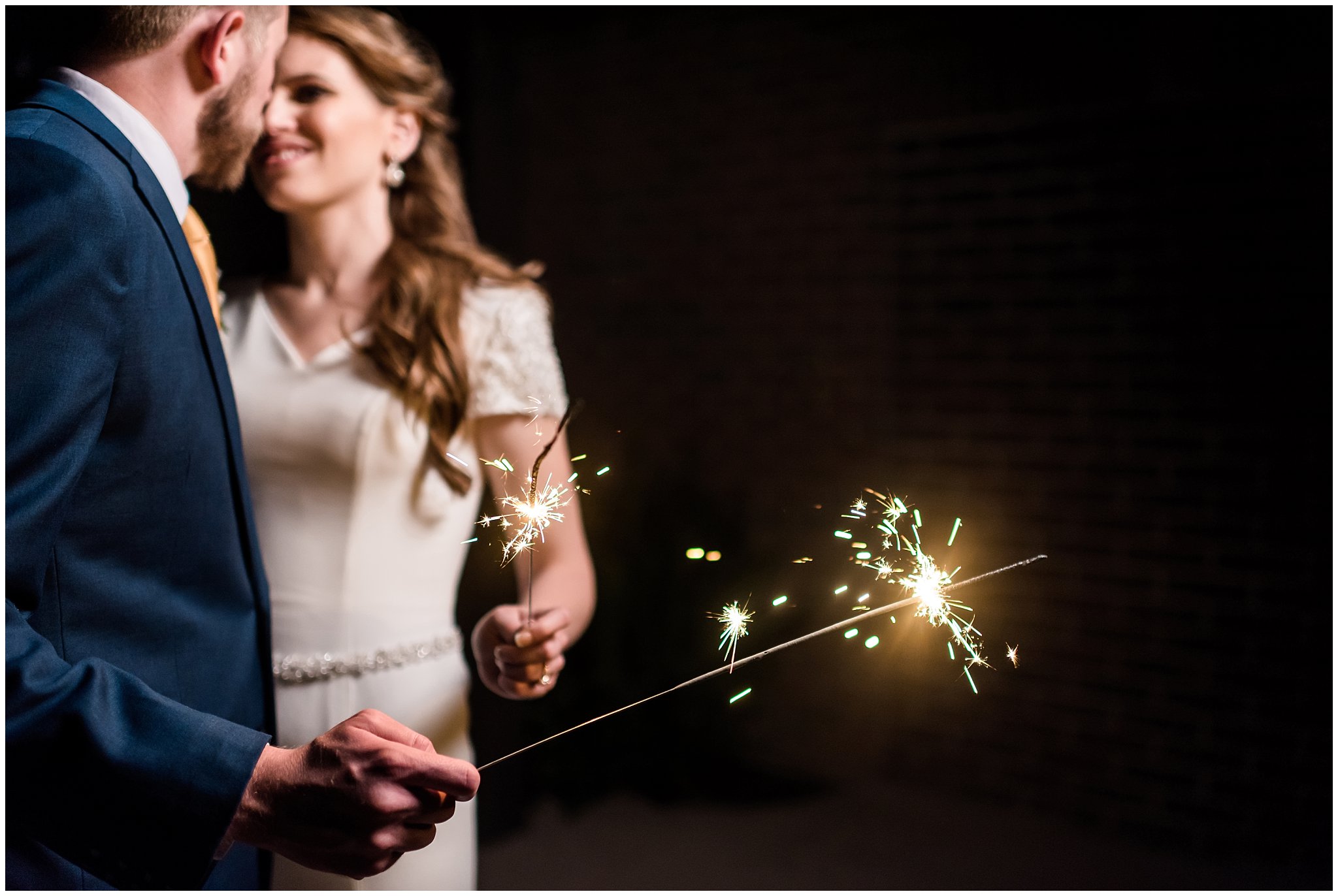Sparkler Exit at Talia Event Center | Bride and groom holding sparklers