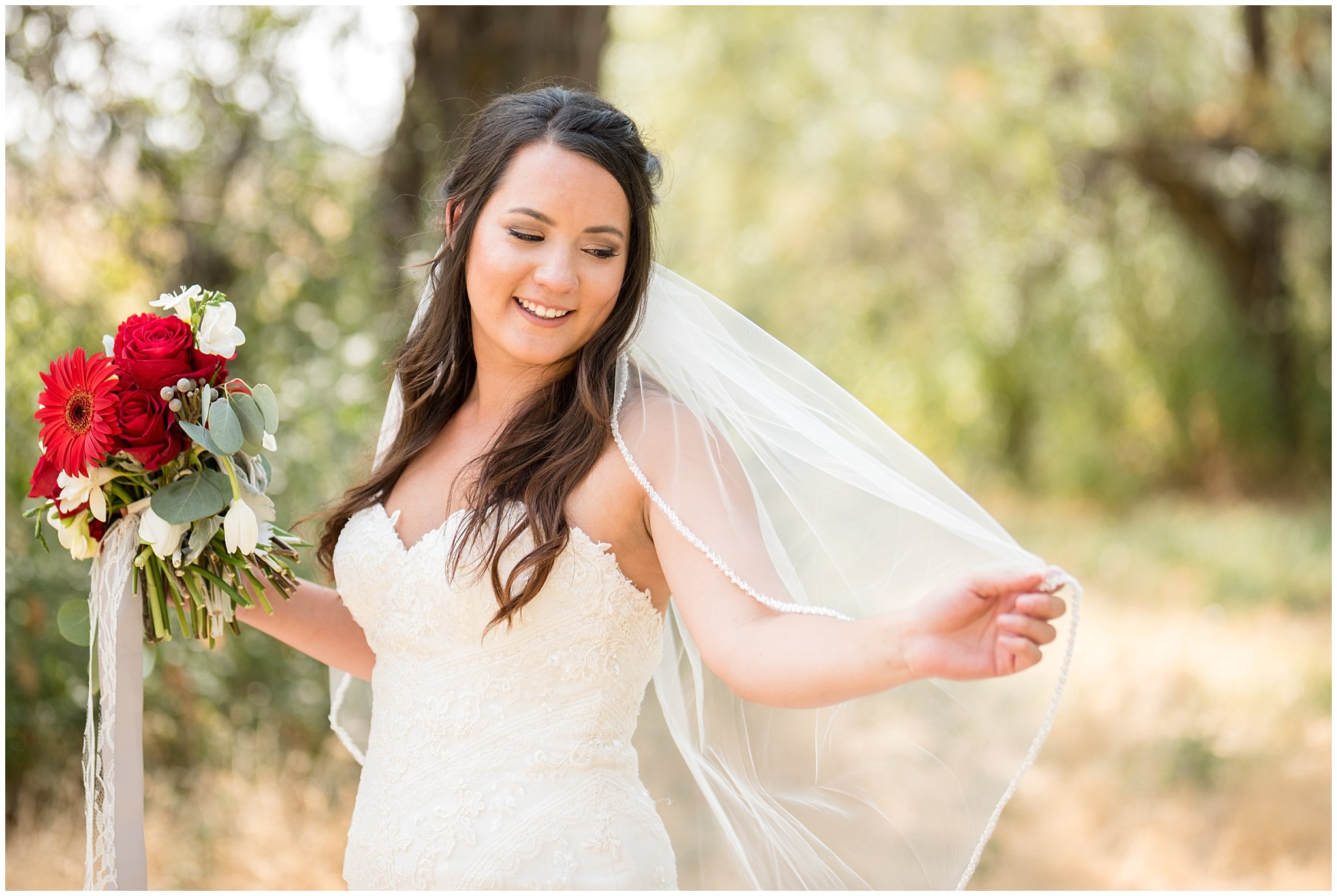 Candid, elegant bridal portrait of bride swooshing her veil | Davis County Outdoor Wedding | Jessie and Dallin Photography