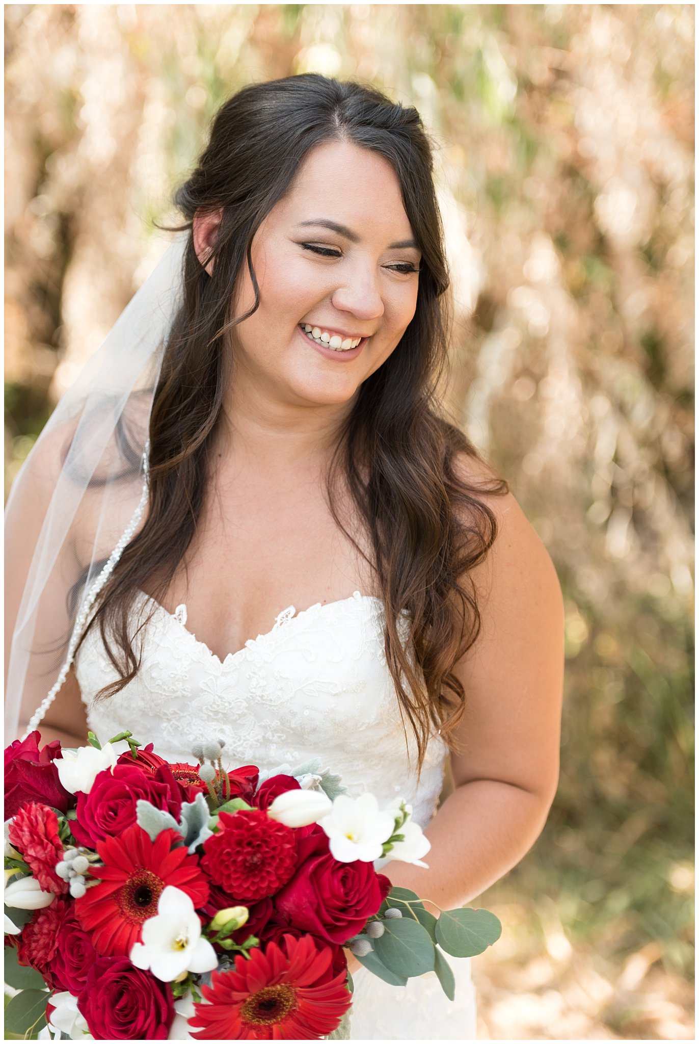 Candid, elegant bridal portrait of laughing bride and red and white bouquet | Davis County Outdoor Wedding | Jessie and Dallin Photography