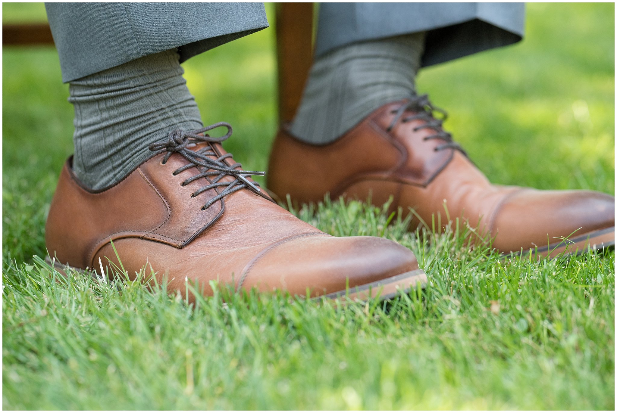 Close up detail of groom's brown leather shoes and grey socks | Davis County Outdoor Wedding | Jessie and Dallin Photography