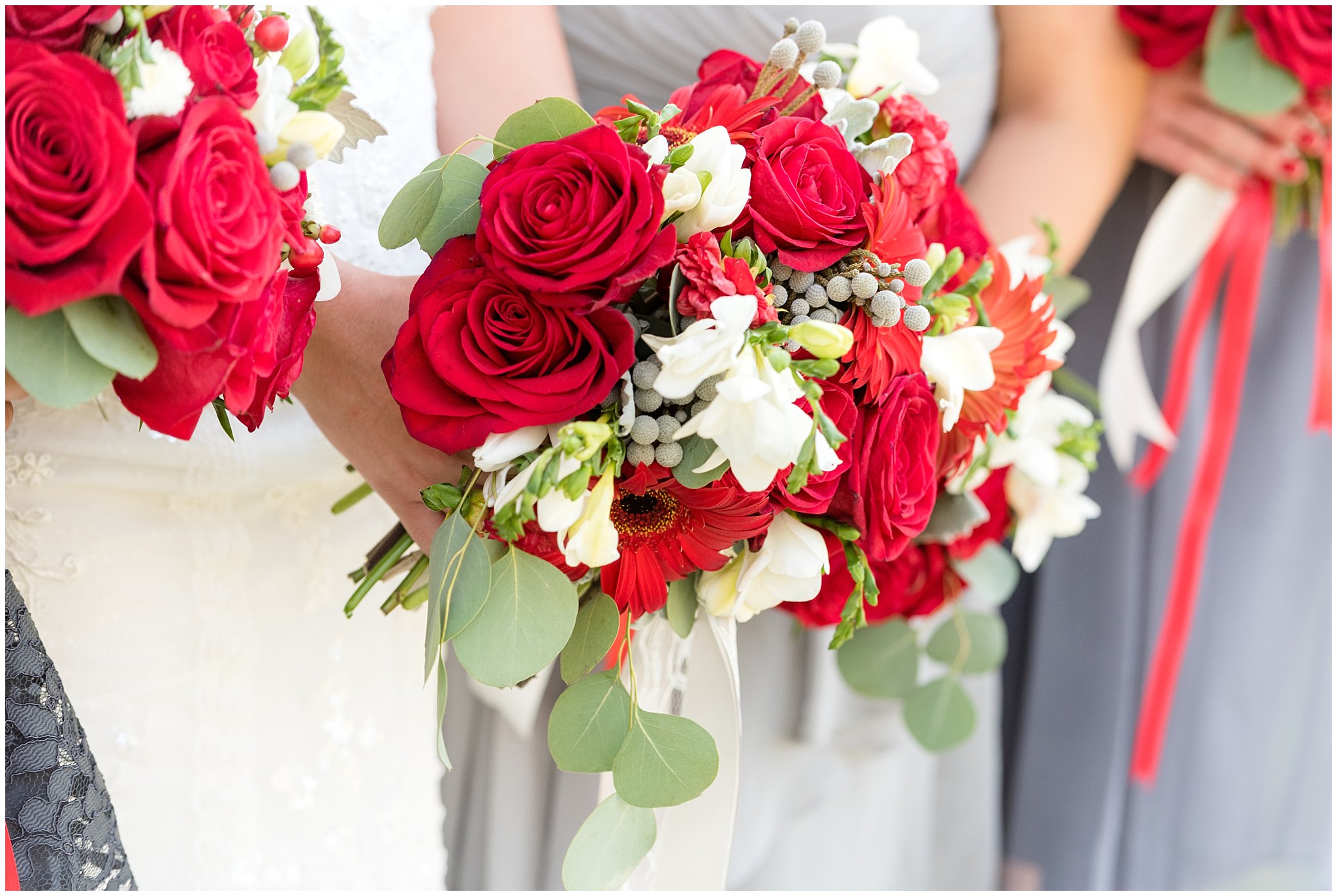 Dancing Daisies Floral | Detail and close up of bride and bridesmaid's red and white wedding bouquets | Davis County Outdoor Wedding | Jessie and Dallin Photography