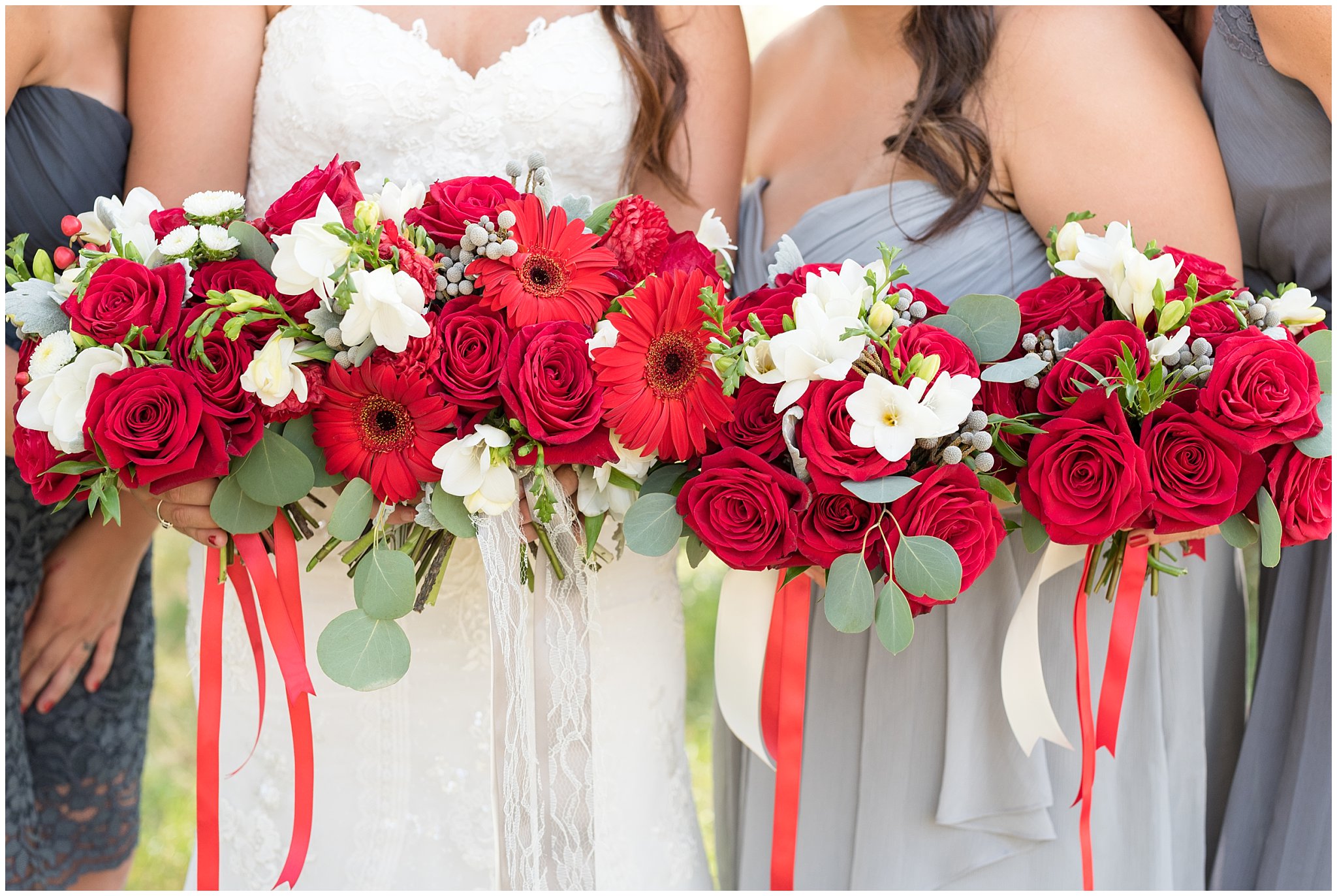Dancing Daisies Floral | Detail and close up line of bride and bridesmaid's red and white wedding bouquets | Davis County Outdoor Wedding | Jessie and Dallin Photography