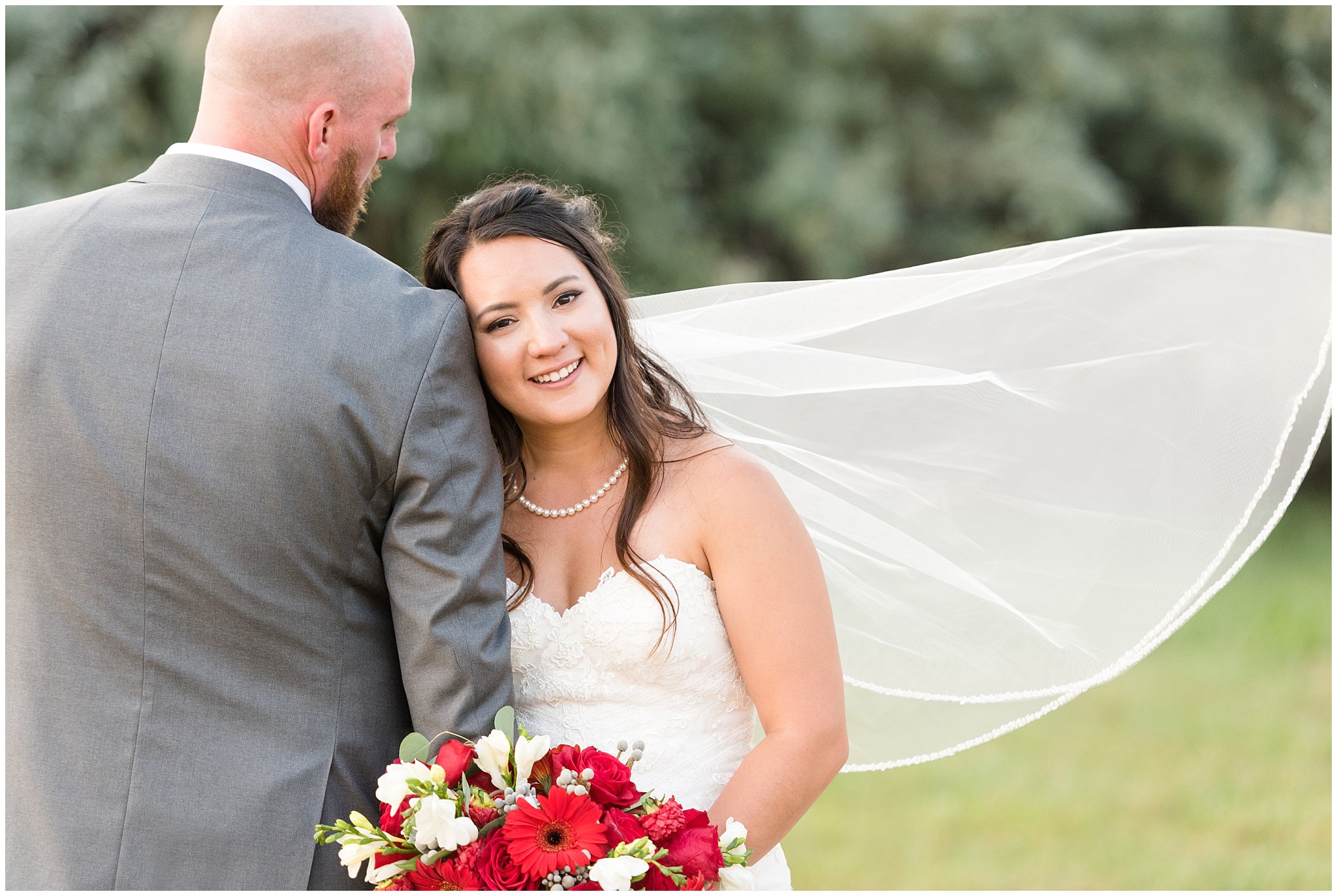 Bride and groom with a veil during sunset portraits | Red and Grey wedding | Davis County Outdoor Wedding | Jessie and Dallin Photography