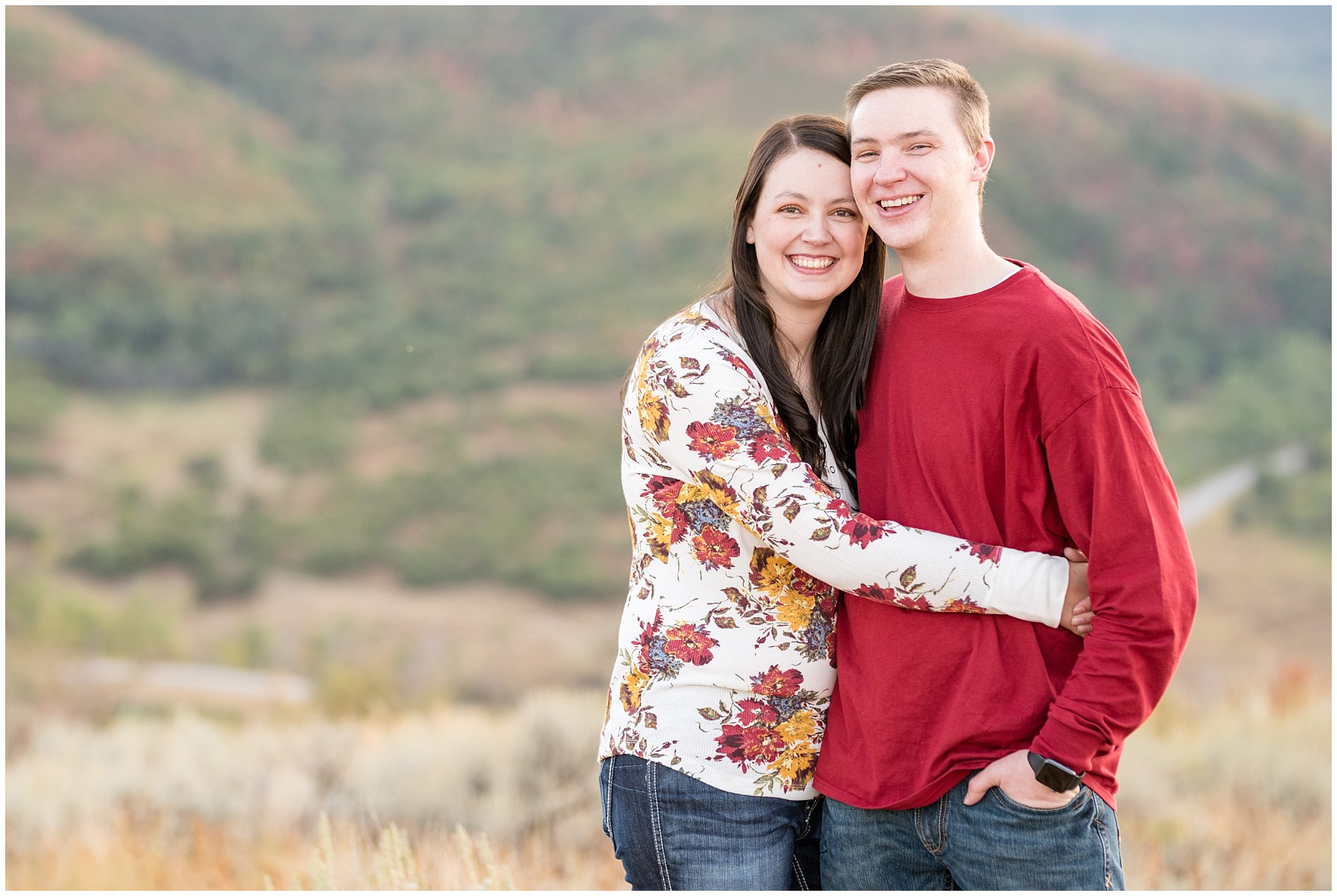 Couple smiling at the camera during family session | Fall Family Pictures at Snowbasin | Jessie and Dallin Photography
