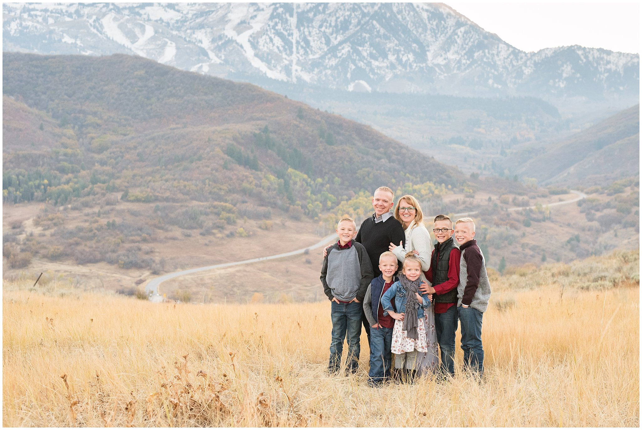 Family Picture in front of snowy mountains | Fall Family Pictures in the Mountains | Snowbasin, Utah | Jessie and Dallin Photography
