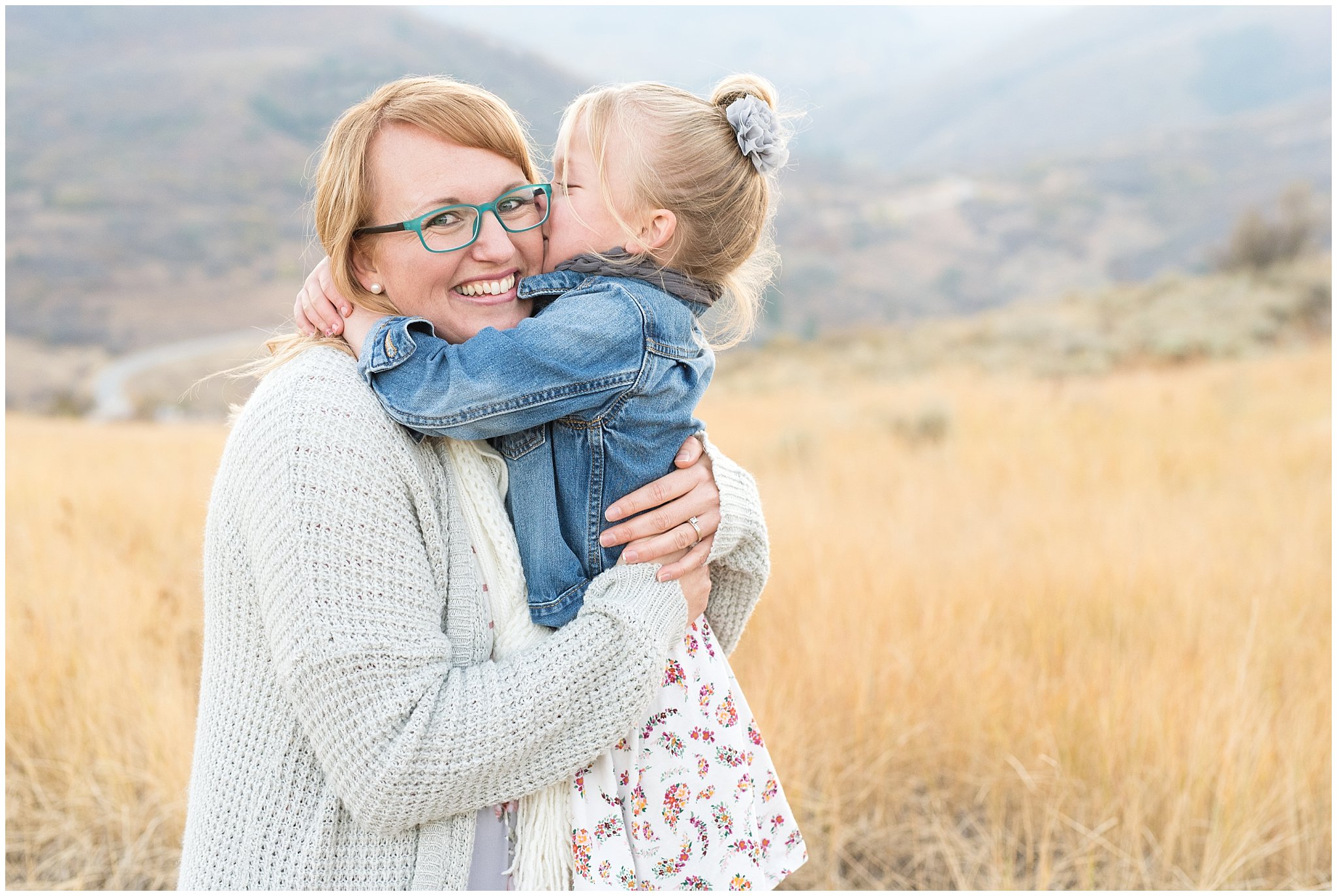 Daughter giving mom a kiss on the cheek | Fall Family Pictures in the Mountains | Snowbasin, Utah | Jessie and Dallin Photography