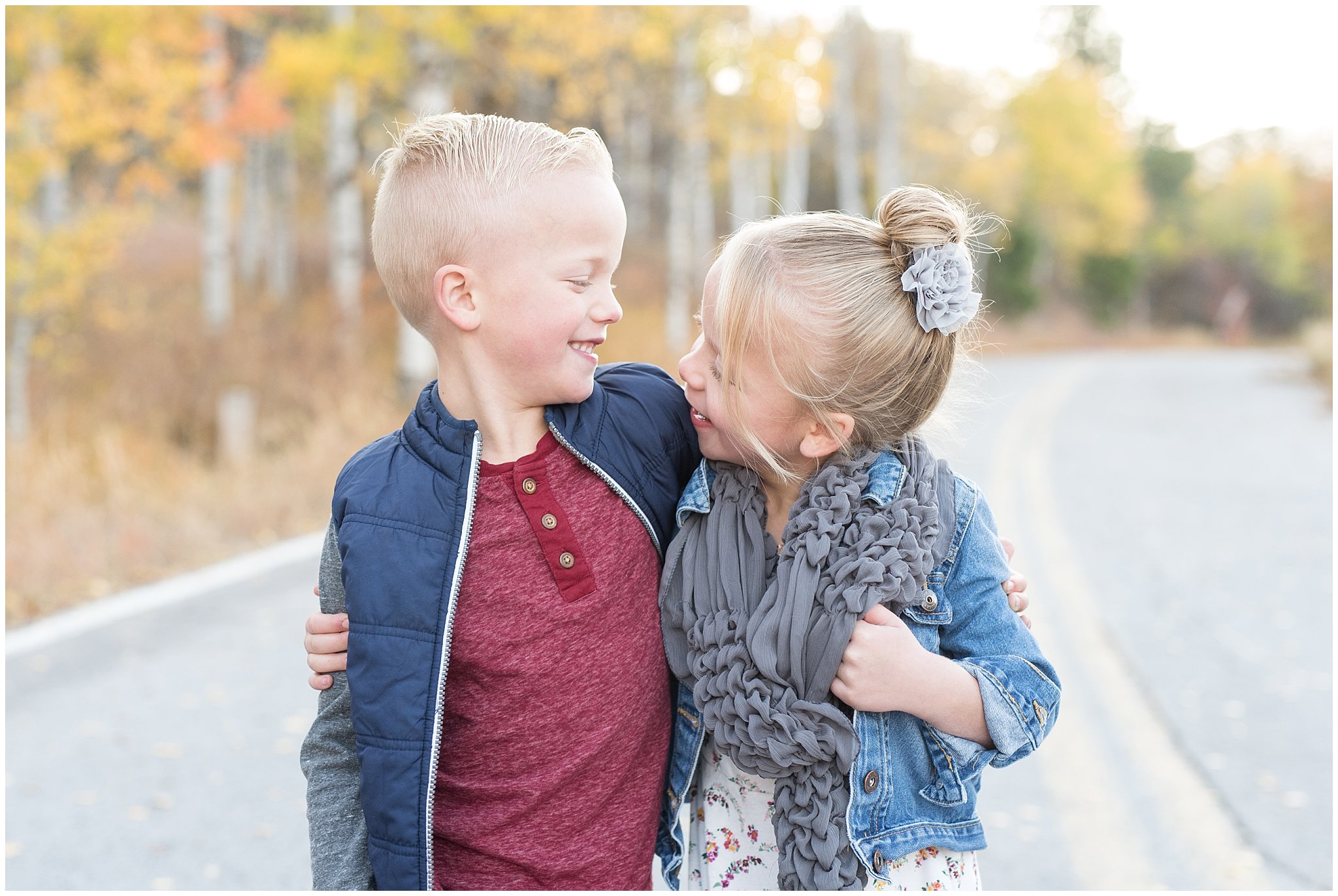 Twin brother and sister laughing at each other | Fall Family Pictures in the Mountains | Snowbasin, Utah | Jessie and Dallin Photography