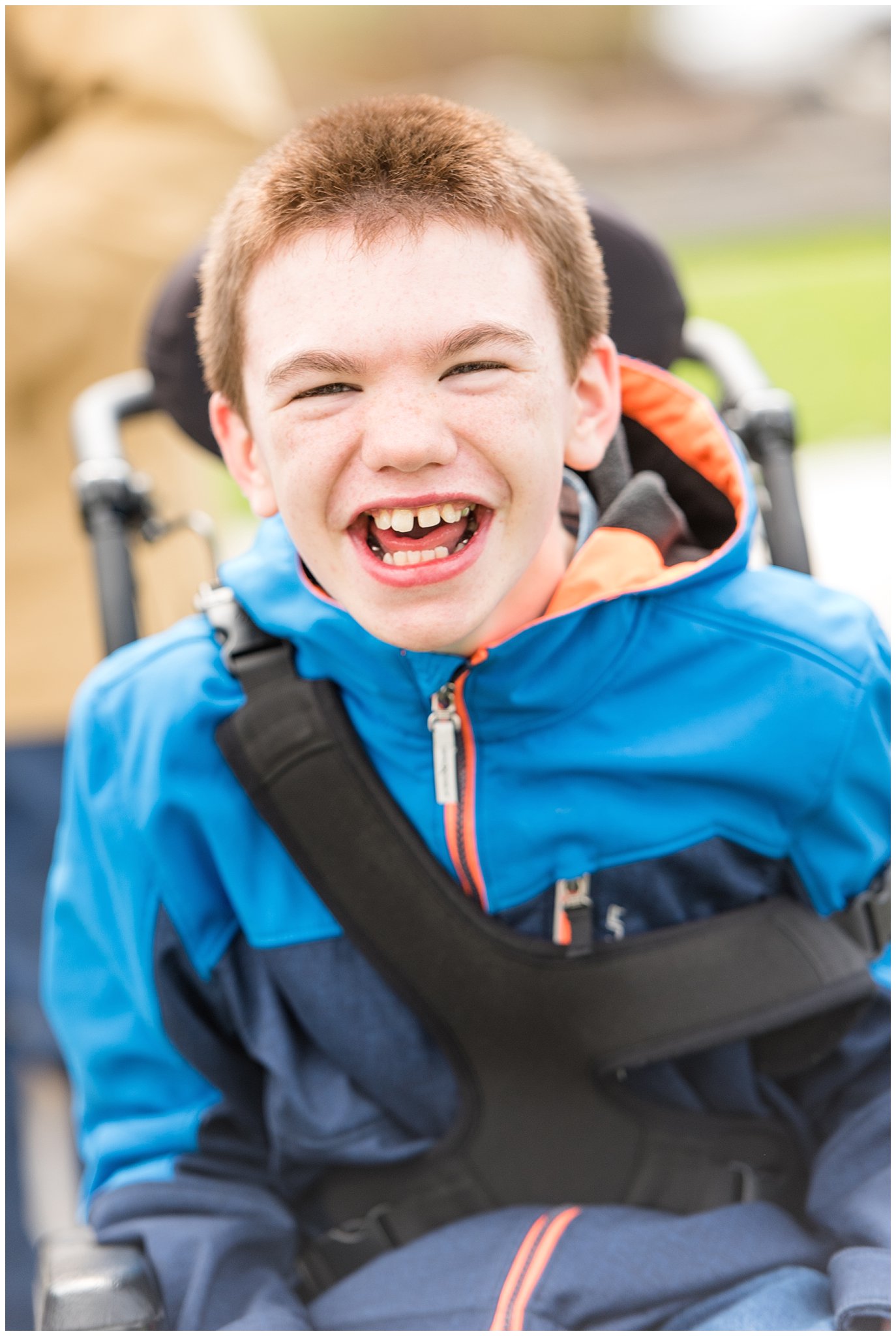 Boy laughing at the camera at Utah Make a Wish event | Tremonton Family Pictures and Make a Wish Event | Jessie and Dallin Photography