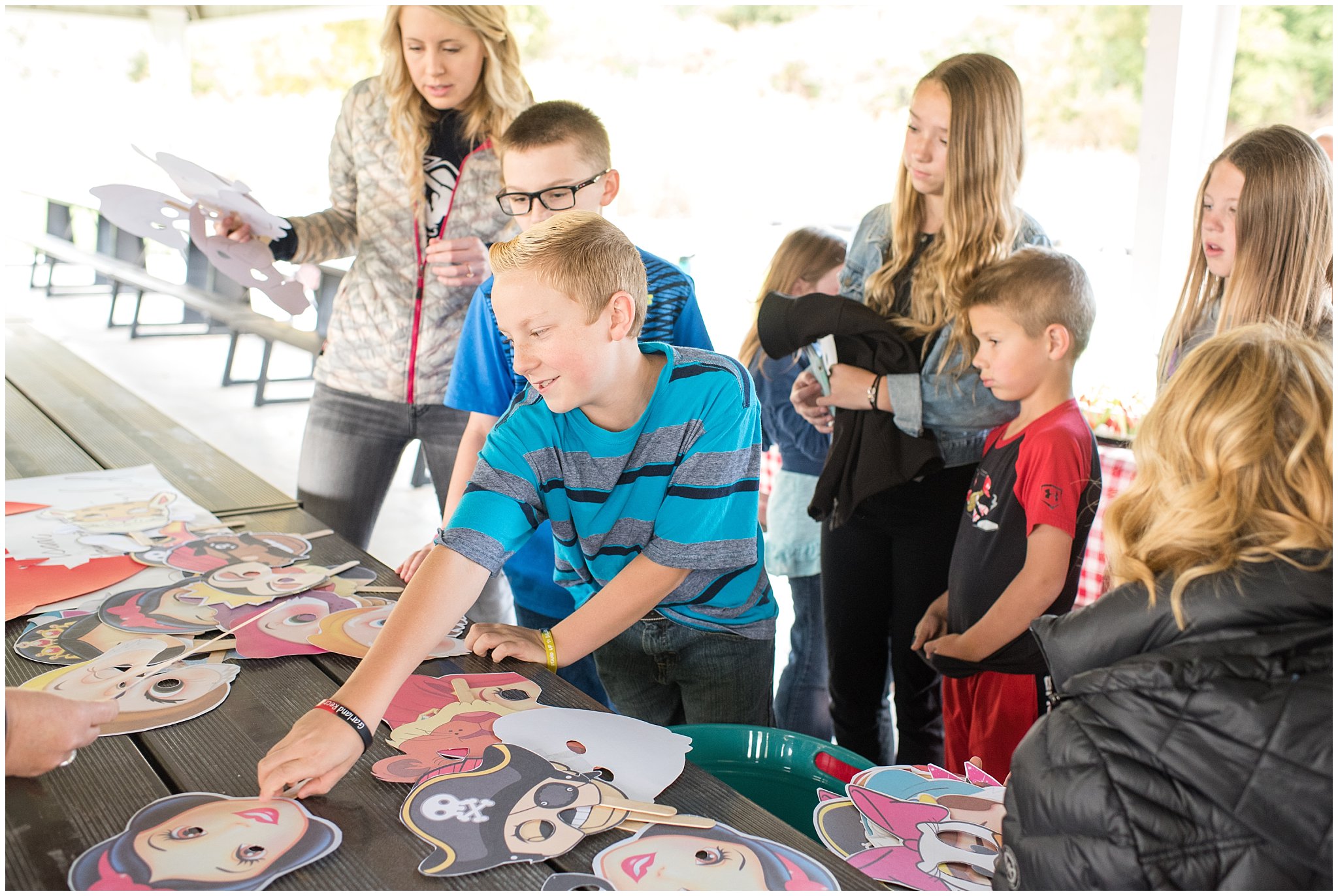 Picking out Disney character masks | Tremonton Family Pictures and Make a Wish Event | Jessie and Dallin Photography