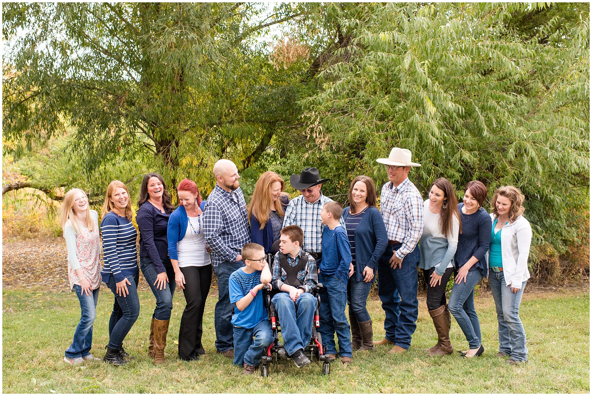 Large family of 12 kids looking at laughing | Tremonton Family Pictures and Make a Wish Event | Jessie and Dallin Photography