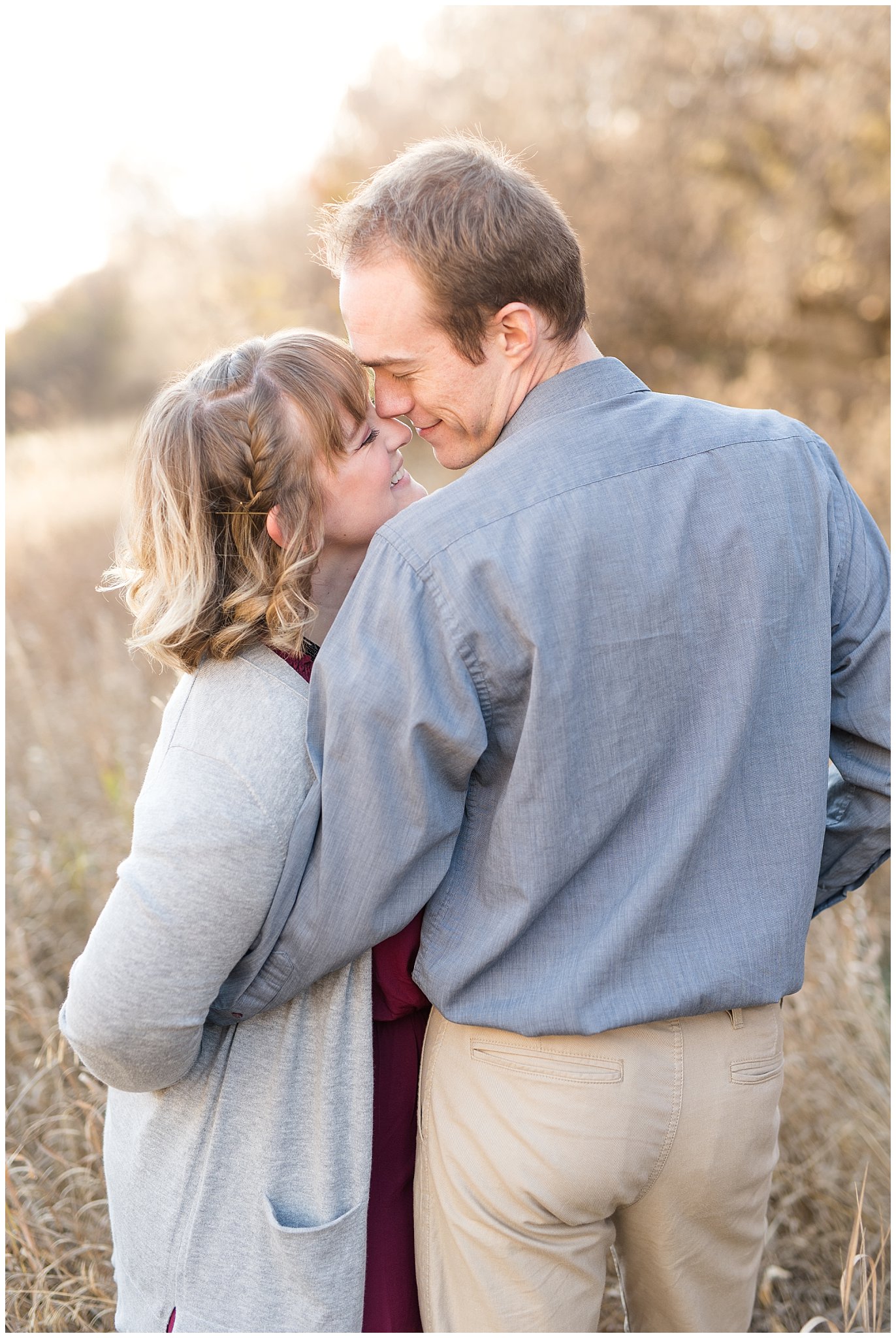 Couple touching noses in a field | Davis County Fall Engagement | Utah Wedding Photographers | Jessie and Dallin