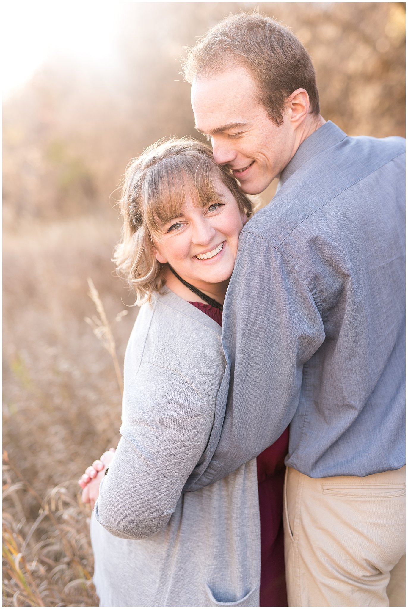 Bride smiling at the camera in a field | Davis County Fall Engagement | Utah Wedding Photographers | Jessie and Dallin