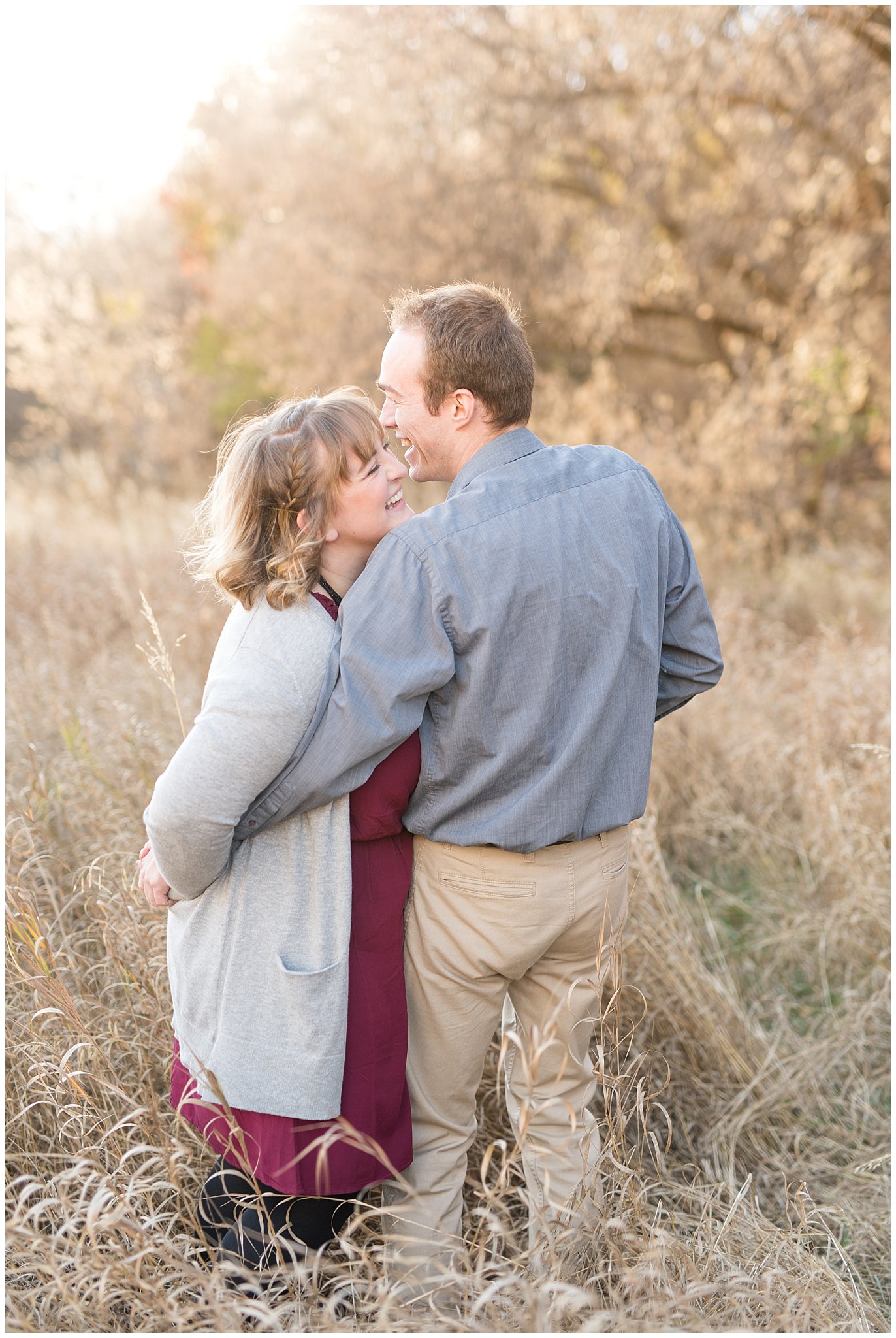 Couple having fun and laughing in a field | Davis County Fall Engagement | Utah Wedding Photographers | Jessie and Dallin