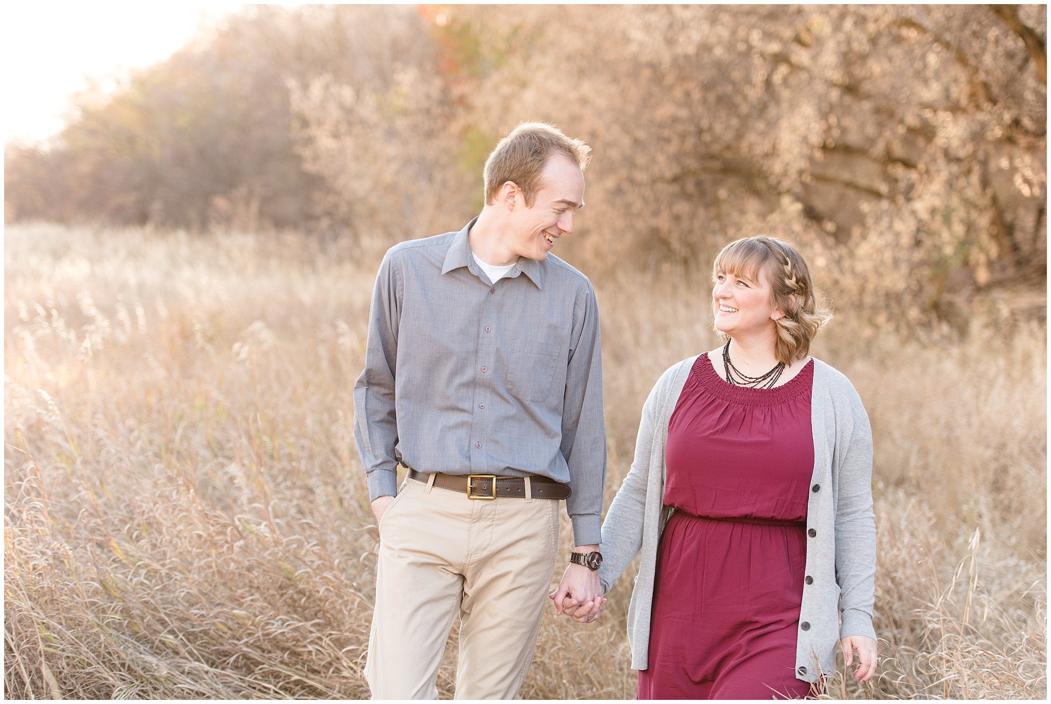 Couple walking and laughing in a field | Davis County Fall Engagement | Utah Wedding Photographers | Jessie and Dallin