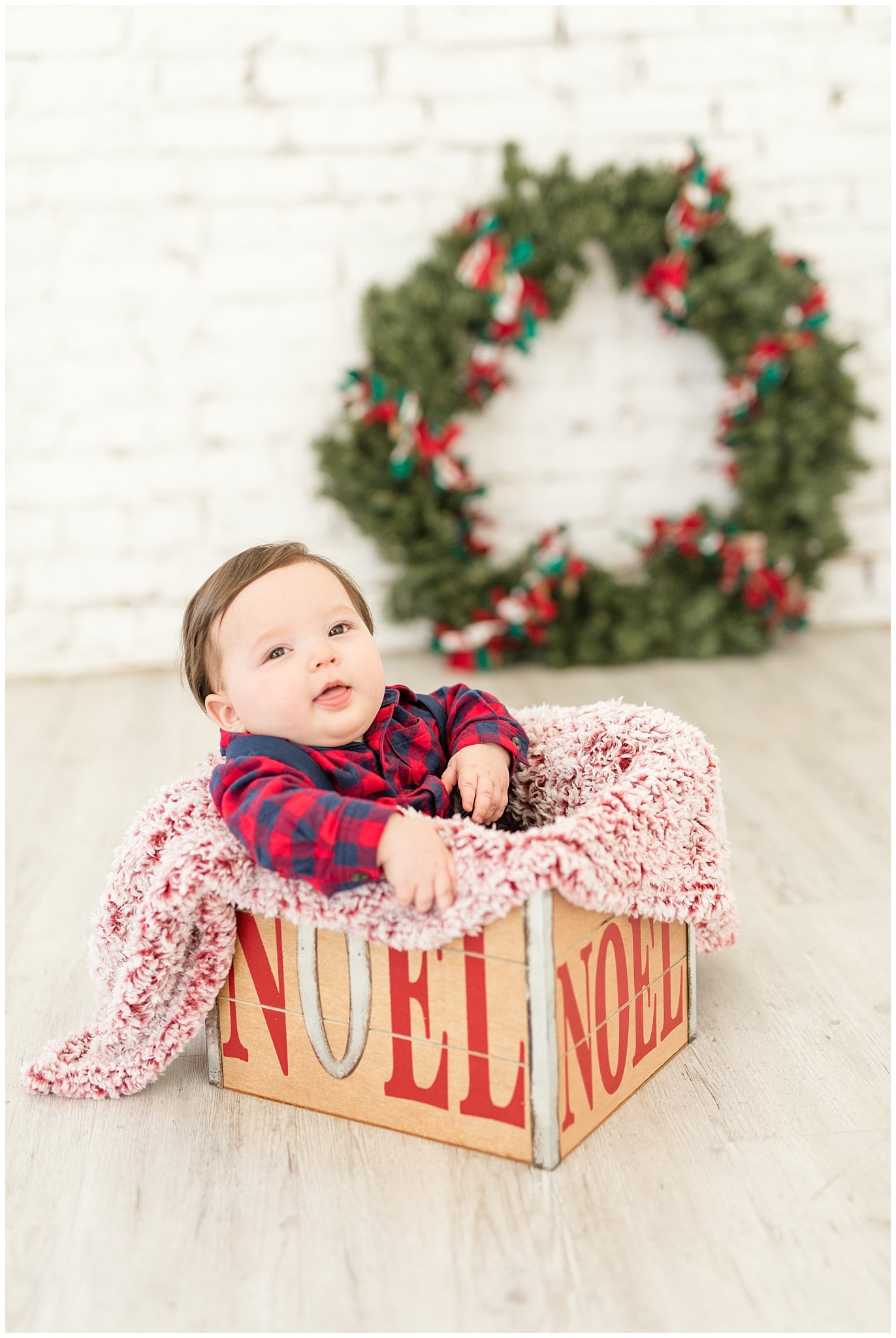 6 month old baby boy in Christmas box | Family Christmas session at the 5th floor | Utah Photographers | Jessie and Dallin Photography
