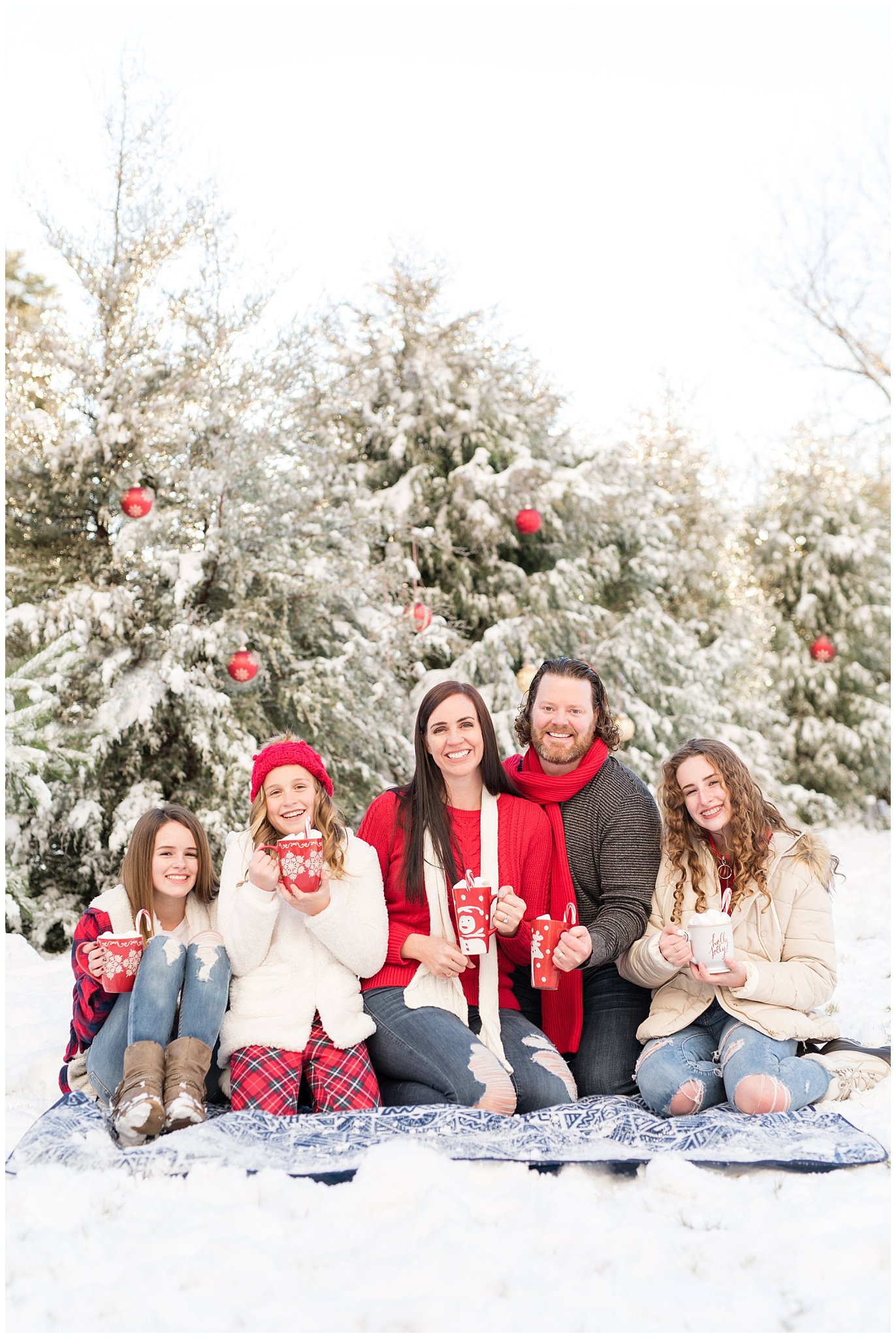 Family with hot chocolate cups in the snow | Utah Family Christmas Photoshoot | Oak Hills Reception and Event | Jessie and Dallin Photography