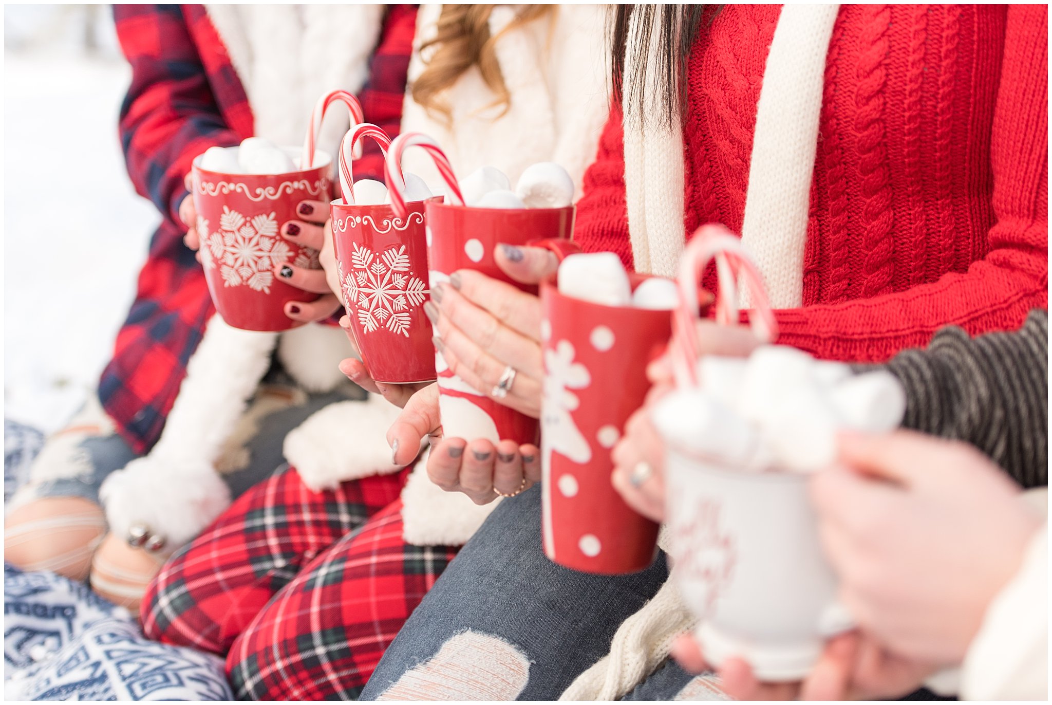Line of cute hot chocolate cups and marshmallows in the snow | Utah Family Christmas Photoshoot | Oak Hills Reception and Event | Jessie and Dallin Photography