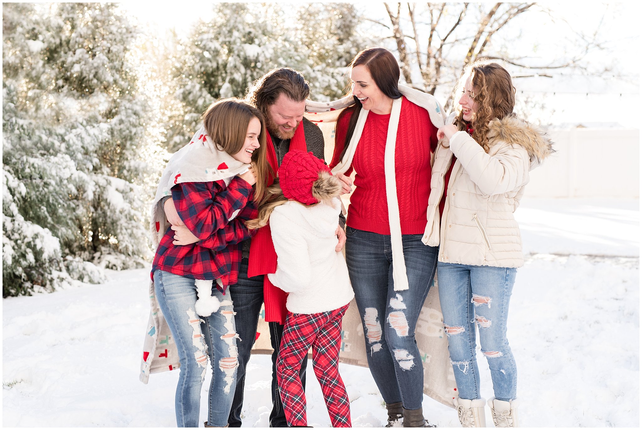 Family laughing and goofing around in the snow | Utah Family Christmas Photoshoot | Oak Hills Reception and Event | Jessie and Dallin Photography