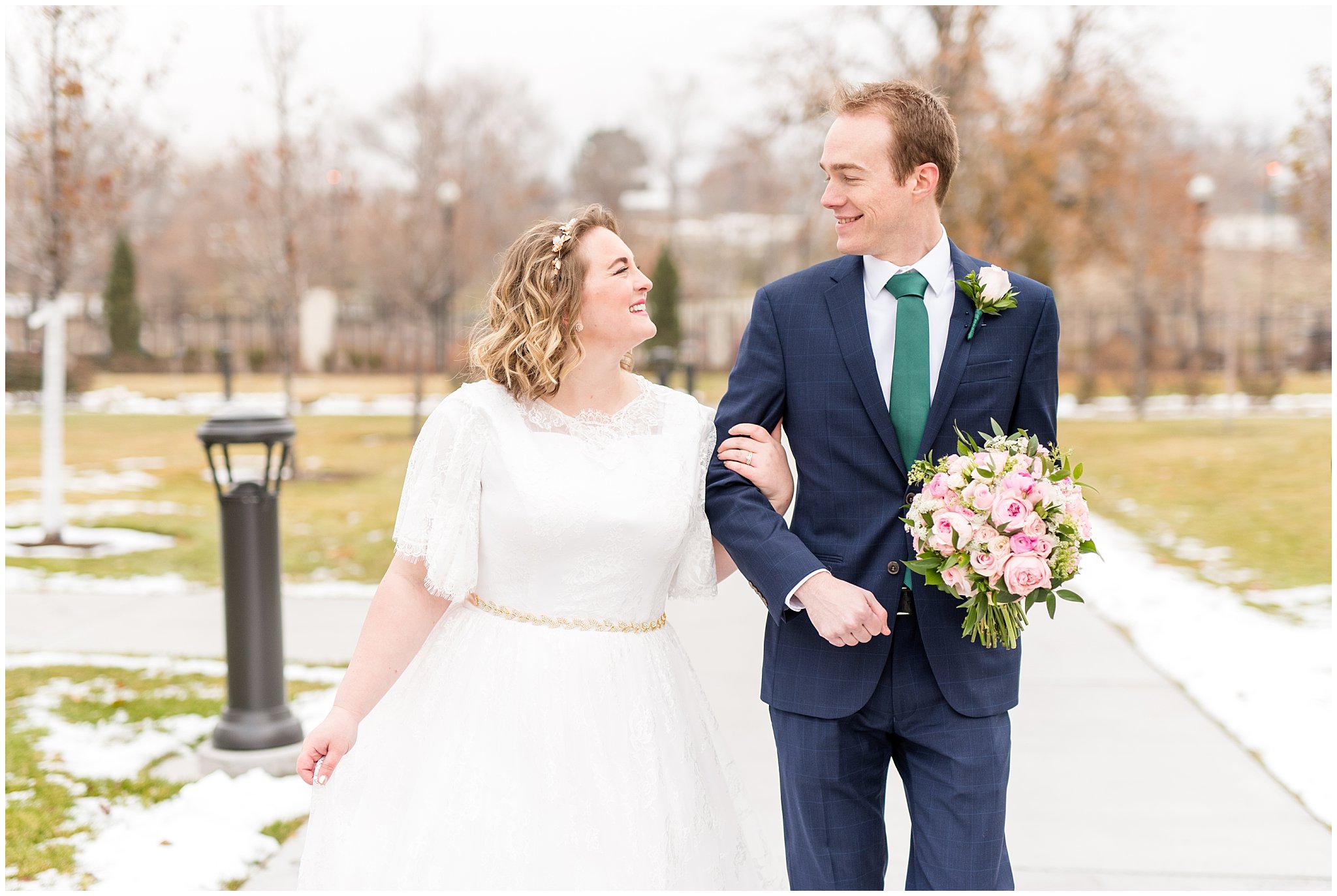 Bride and groom walking and smiling | Ogden Temple Winter Wedding | Emerald Green and Pink Wedding | Jessie and Dallin Photography