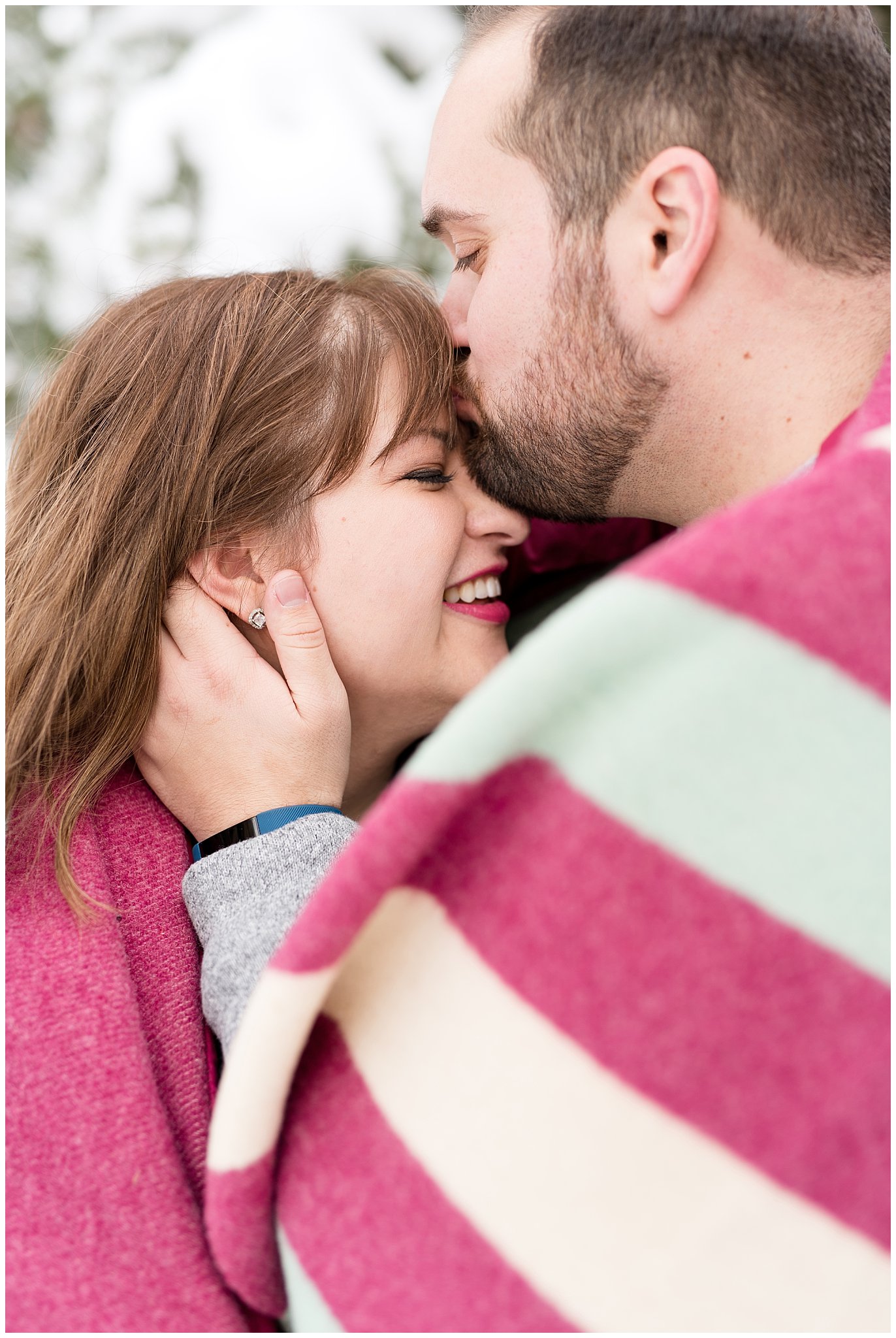 Guy kisses girl on the forehead | Winter Engagement at Mueller Park and the Utah State Capitol | Jessie and Dallin Photography