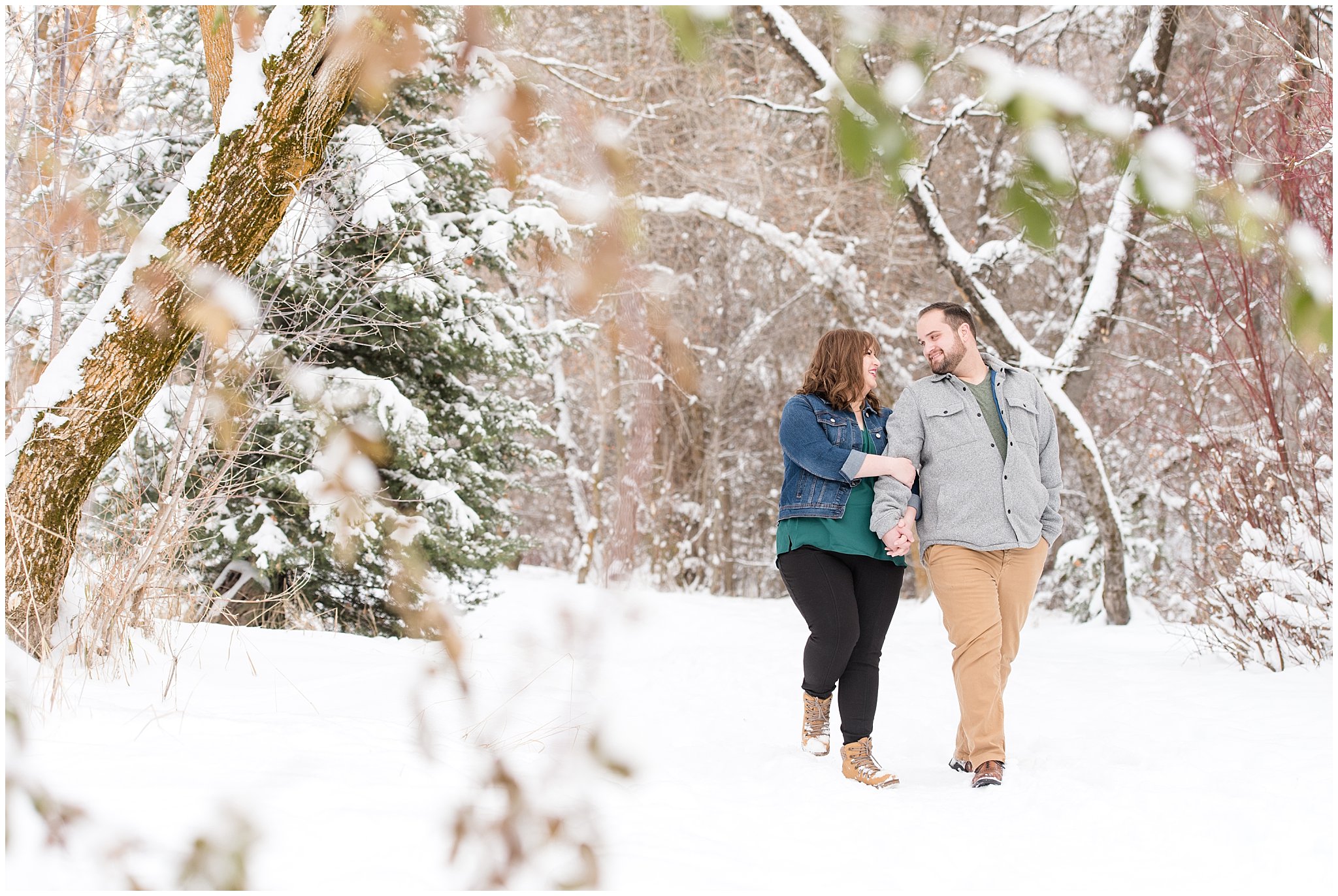 Couple walking through the winter forest | Winter Engagement at Mueller Park and the Utah State Capitol | Jessie and Dallin Photography