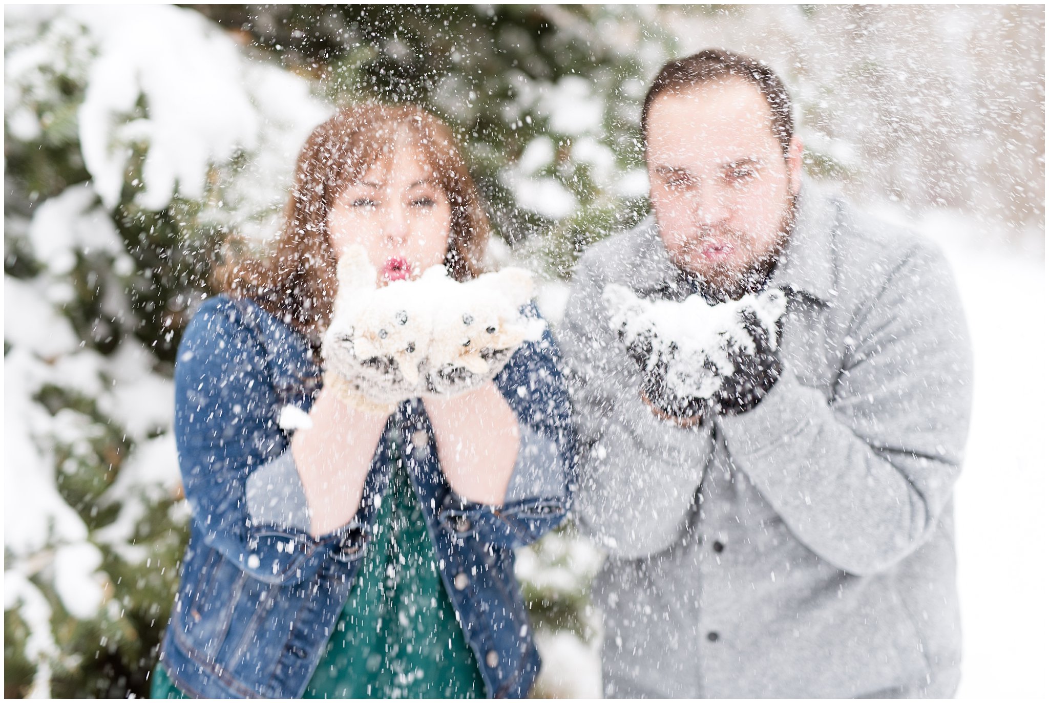 Couple blowing snow out of their hands | Winter Engagement at Mueller Park and the Utah State Capitol | Jessie and Dallin Photography