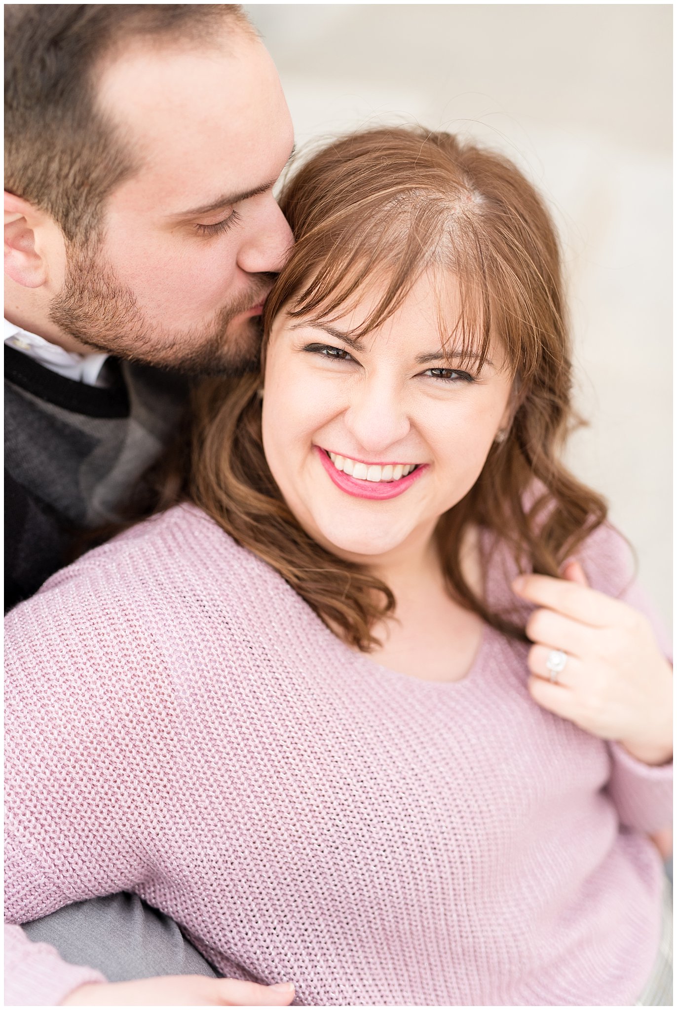Girl smiling at the camera while guy kisses her on the forehead | Winter Engagement at Mueller Park and the Utah State Capitol | Jessie and Dallin Photography