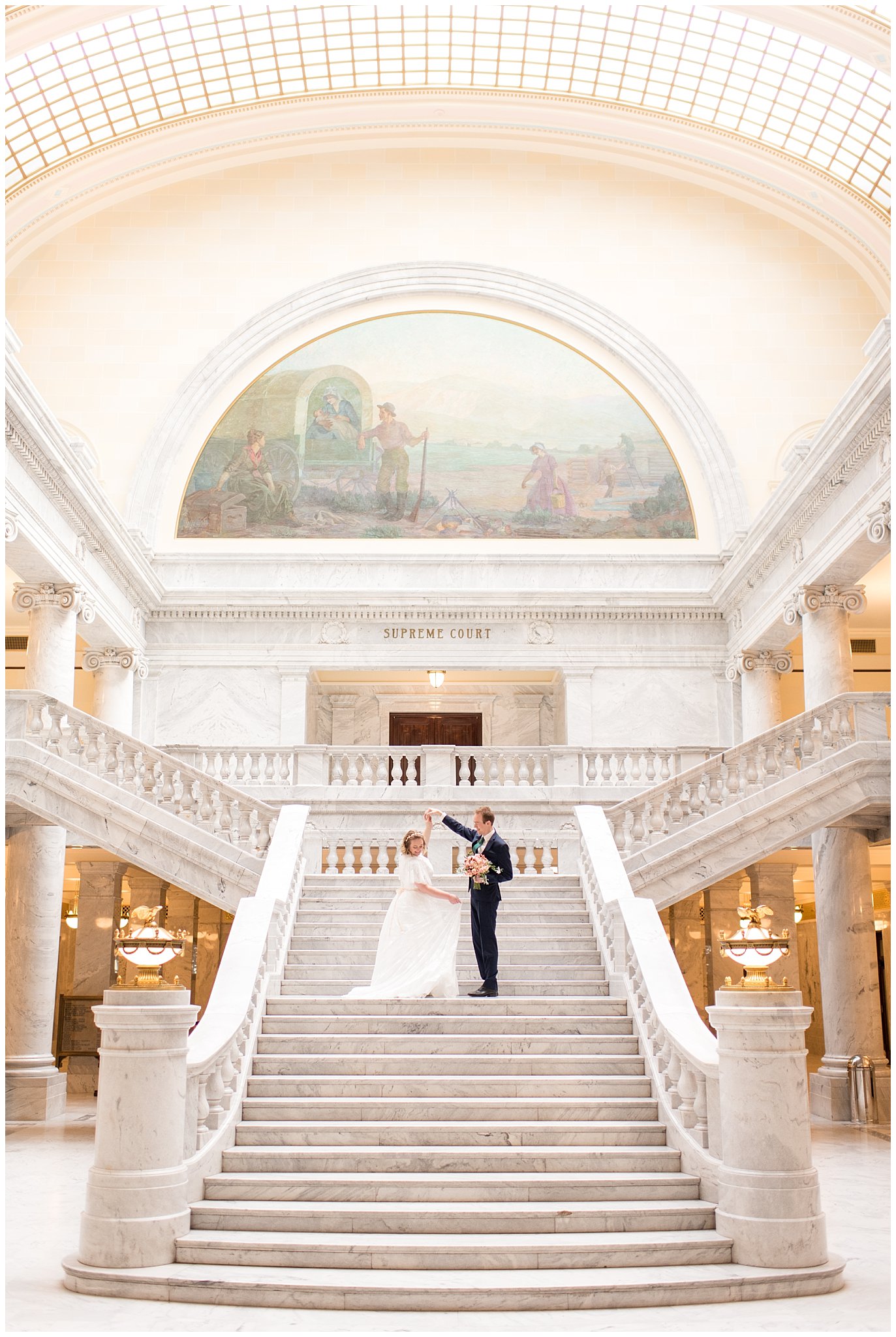 Bride and groom on the grand staircase of the capitol building | Winter Formals at the Utah State Capitol | Utah Wedding Photography