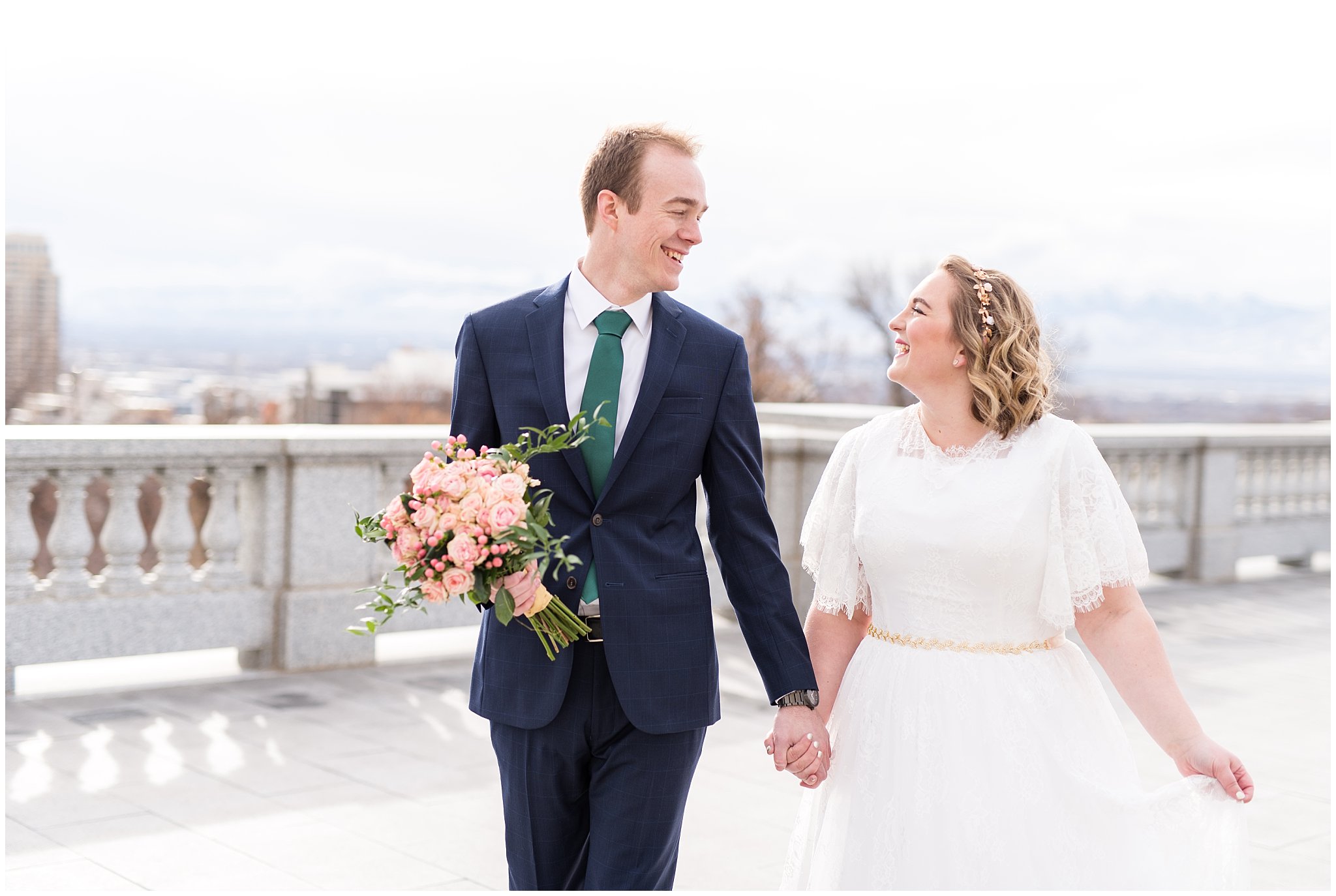 Bride and groom walking and groom holding bouquet | Winter Formals at the Utah State Capitol | Utah Wedding Photography