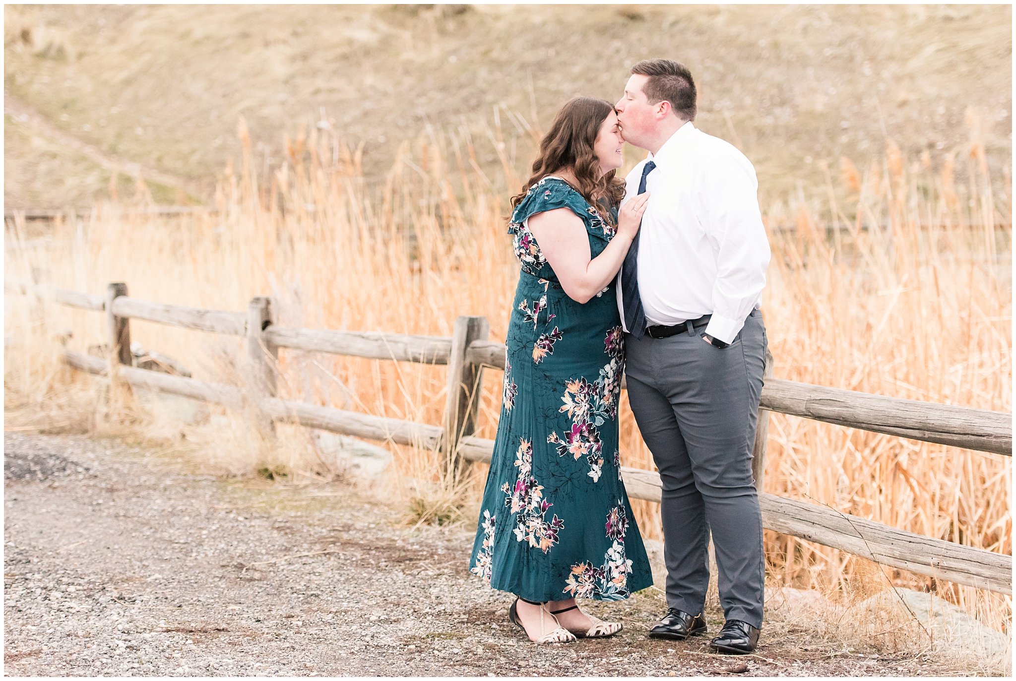 Couple dressed up in white shirt and tie and green blue floral dress by the mountains | Downtown Logan and Green Canyon Engagements | Utah Wedding Photographers | Jessie and Dallin Photography