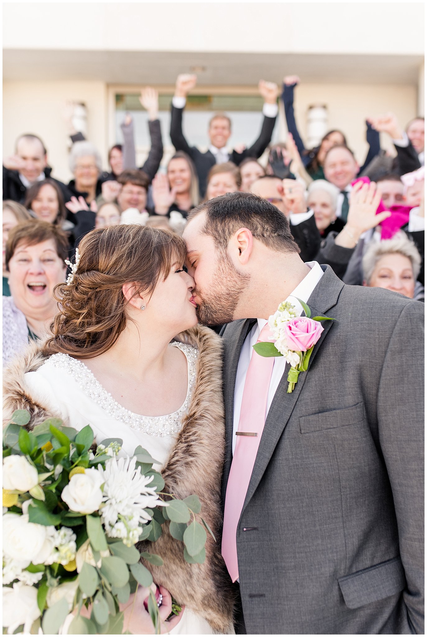 Couple kisses to cheering | Ogden Temple Wedding | Jessie and Dallin Photography