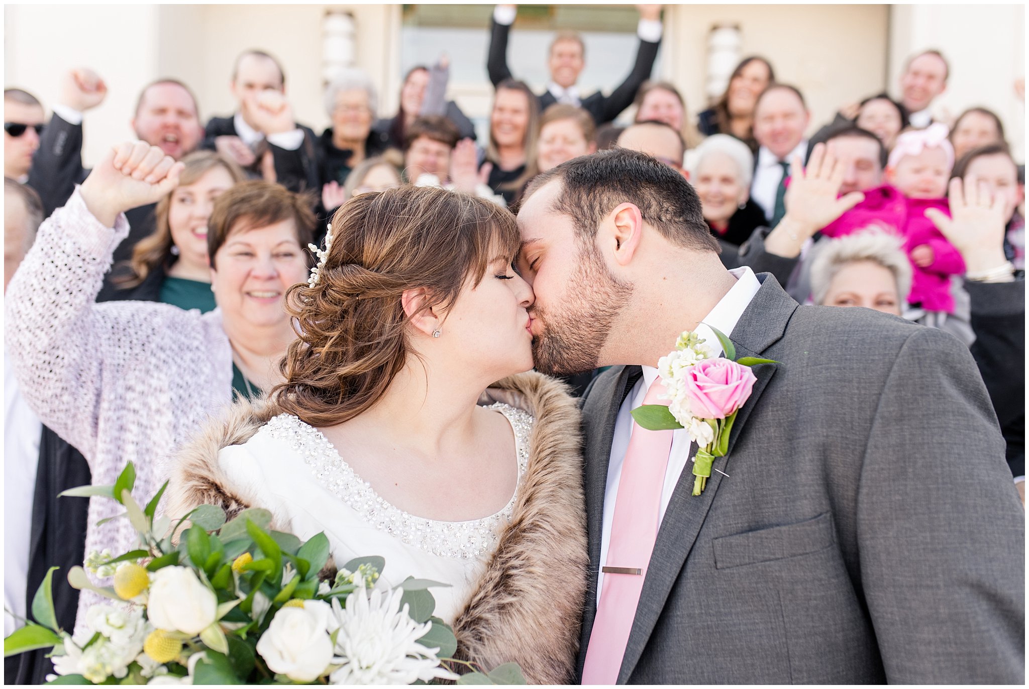Bride and groom kiss with cheers | Ogden Temple Wedding | Jessie and Dallin Photography