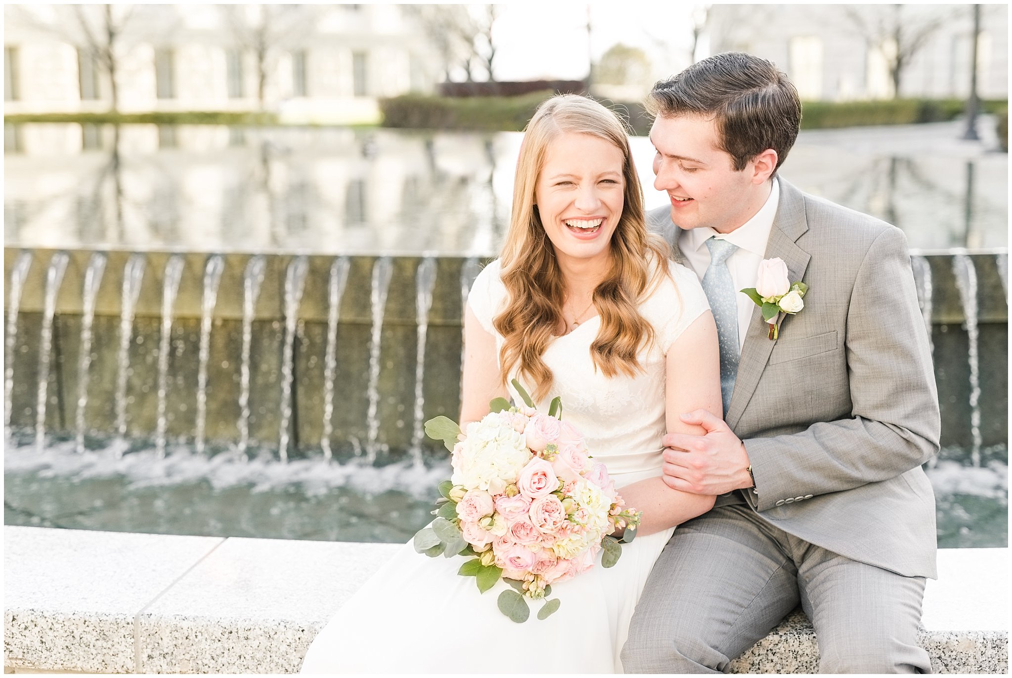 Bride with blush bouquet and groom with grey suit by capitol reflection pool | Utah State Capitol Blossoms Formal Session | Salt Lake Wedding Photographers | Jessie and Dallin Photography