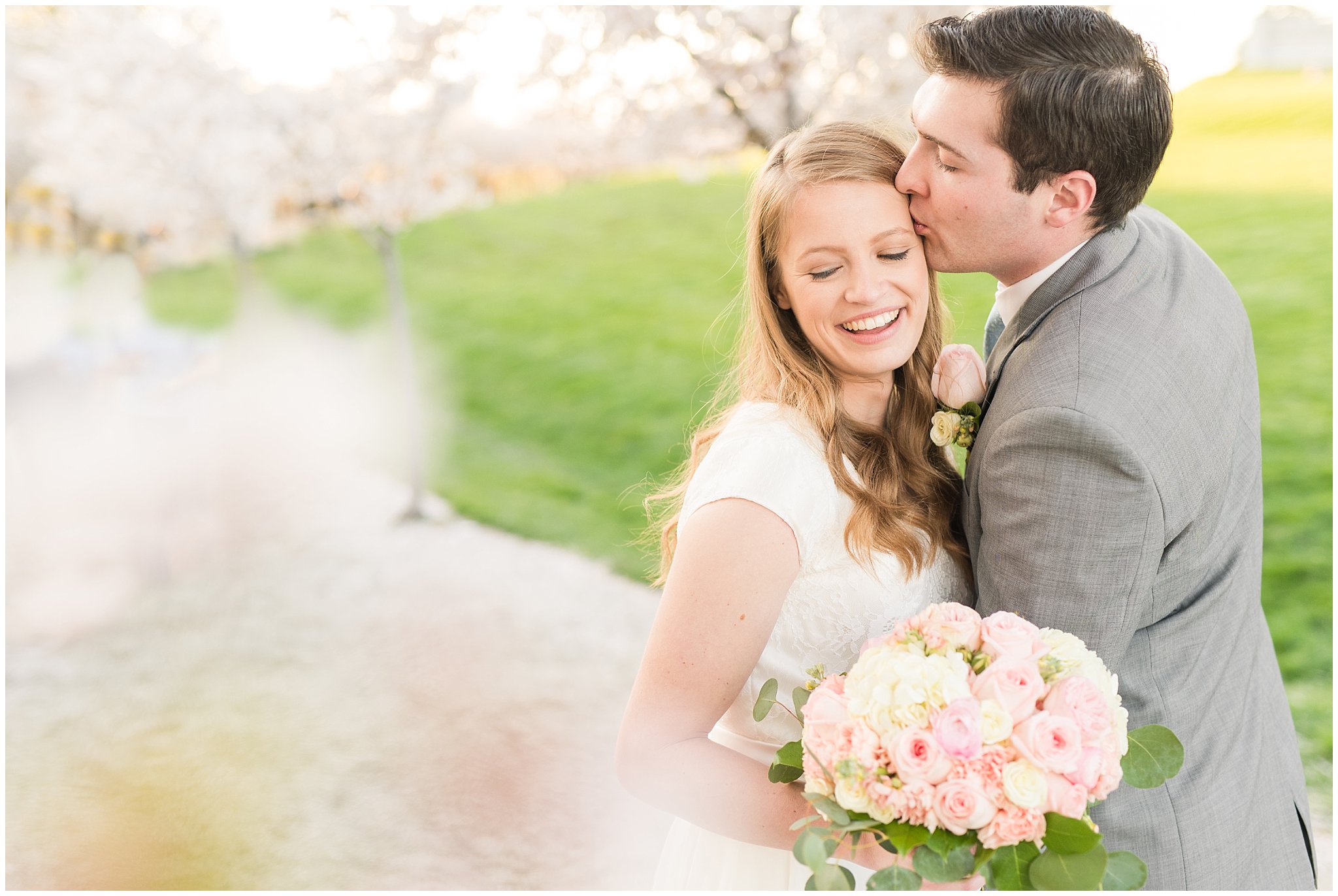 Bride with blush bouquet and groom with grey suit in the cherry blossoms | Utah State Capitol Blossoms Formal Session | Salt Lake Wedding Photographers | Jessie and Dallin Photography