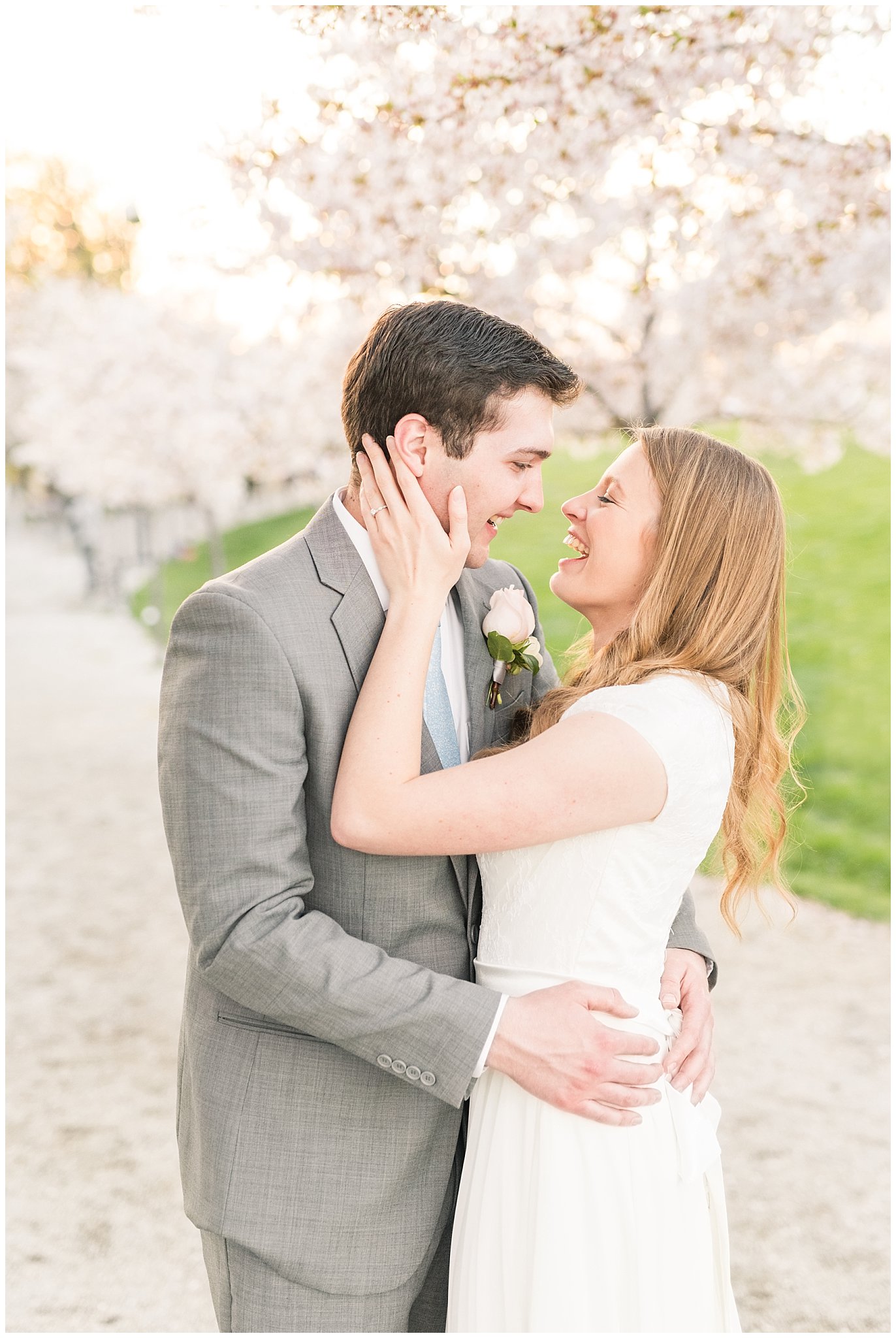 Bride with blush bouquet and groom with grey suit in the cherry blossoms | Utah State Capitol Blossoms Formal Session | Salt Lake Wedding Photographers | Jessie and Dallin Photography