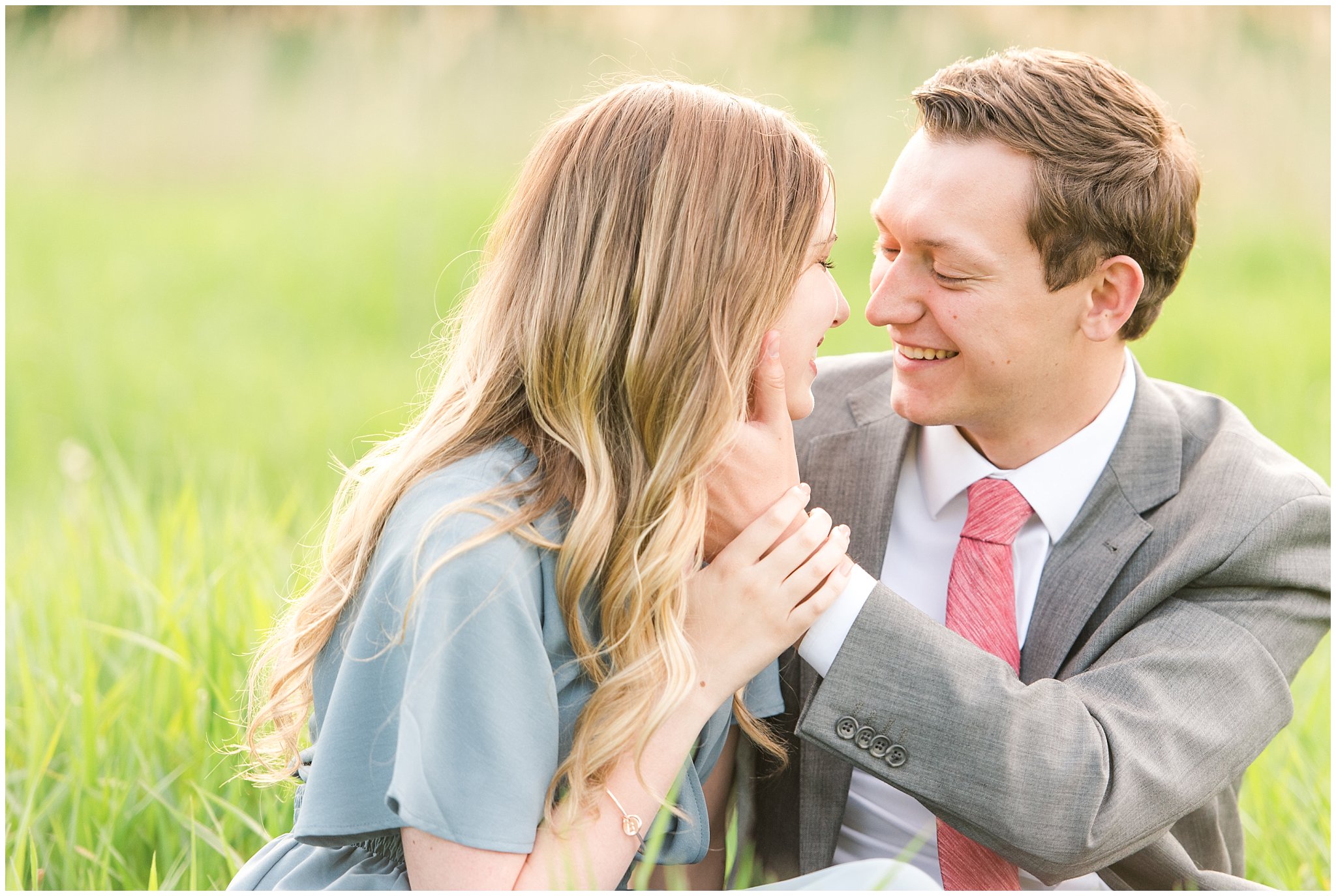 Couple dressed up in flowy blue dress and grey suit for engagement in the woods | Utah Engagement | Jessie and Dallin Photography