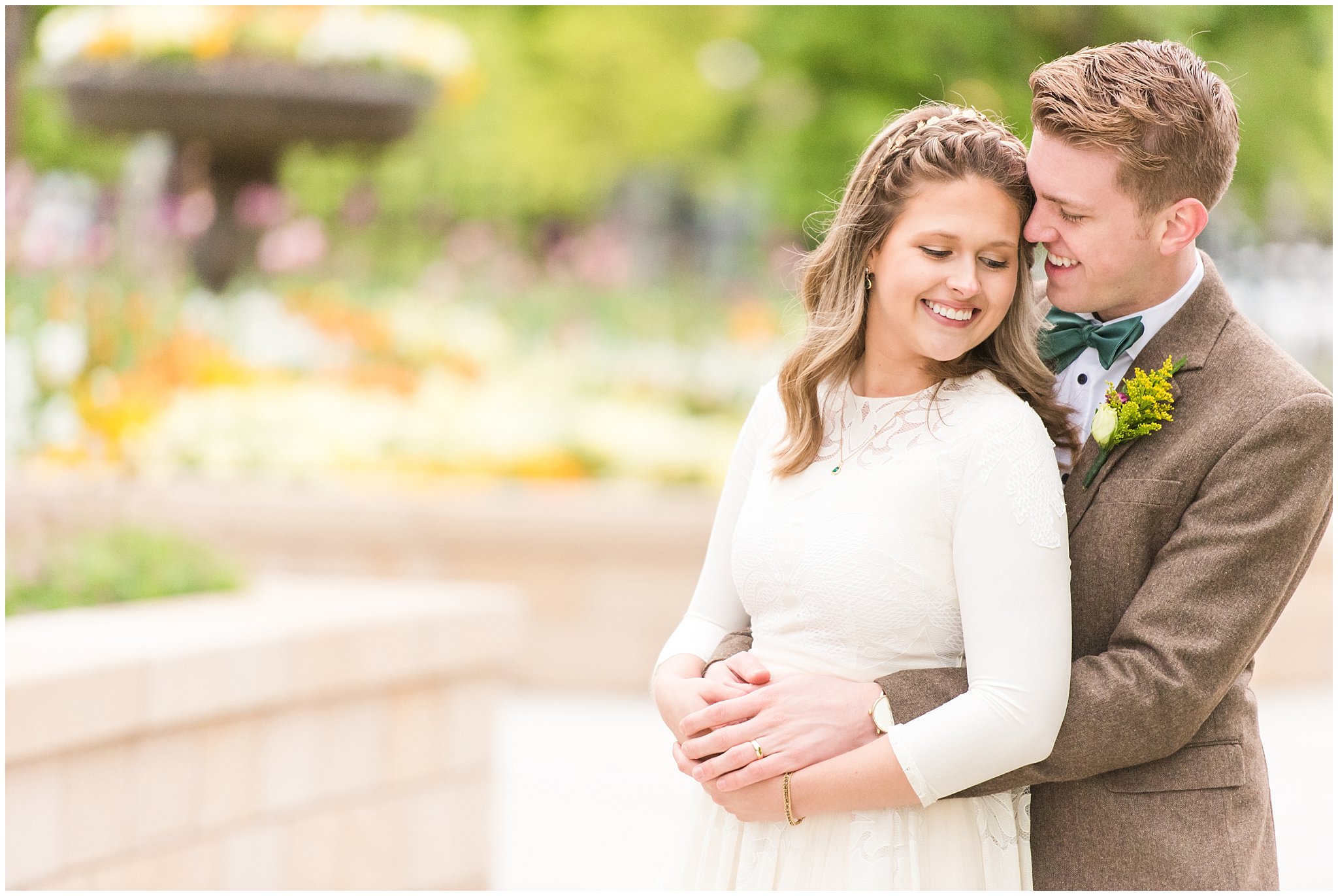 Bride wearing flowy dress and groom wearing tweed suit and green bow tie for vintage inspired wedding attire | Emerald green, gold wedding colors | Provo City Center Temple Spring Formal Session | Jessie and Dallin Photography