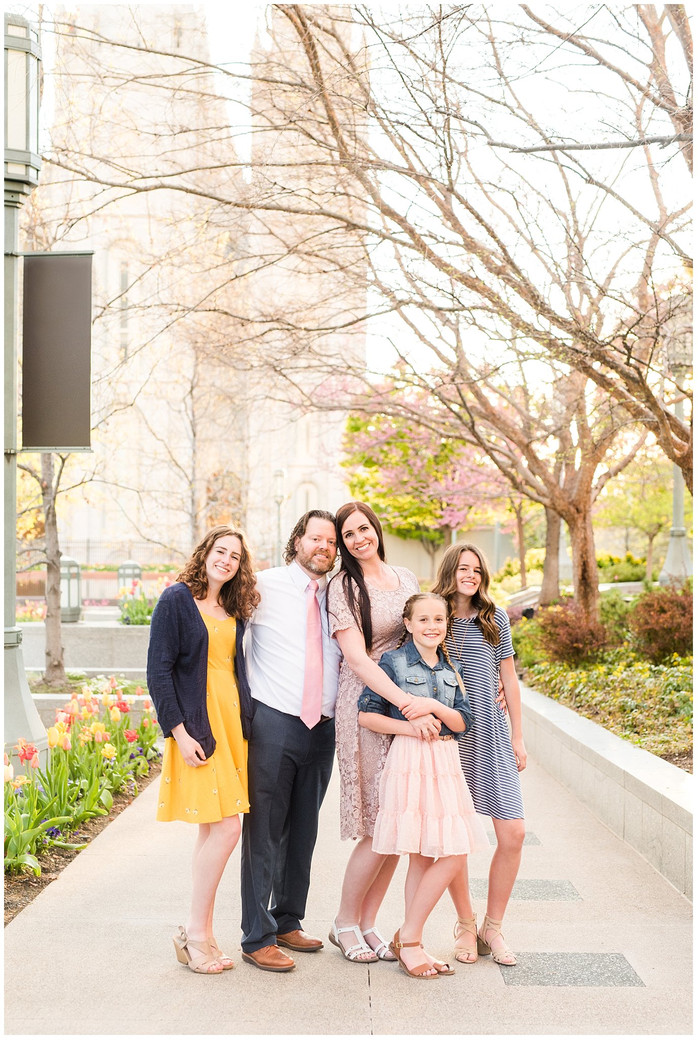 Family dressed up in blush, blue, and yellow after spring temple sealing | Sealing at the Salt Lake Temple and Grand America | Jessie and Dallin Photography