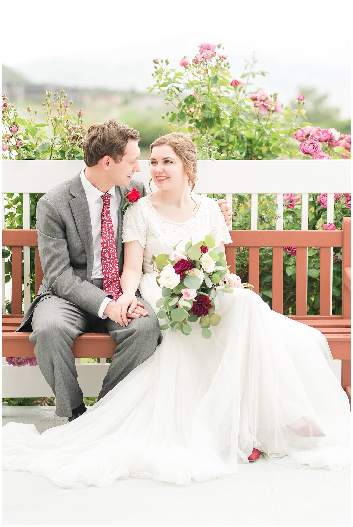 Bride and groom portraits on bench | Grey, Burgundy, and Gold Wedding | Draper Temple and South Mountain Wedding | Utah Wedding Photographers | Jessie and Dallin Photography